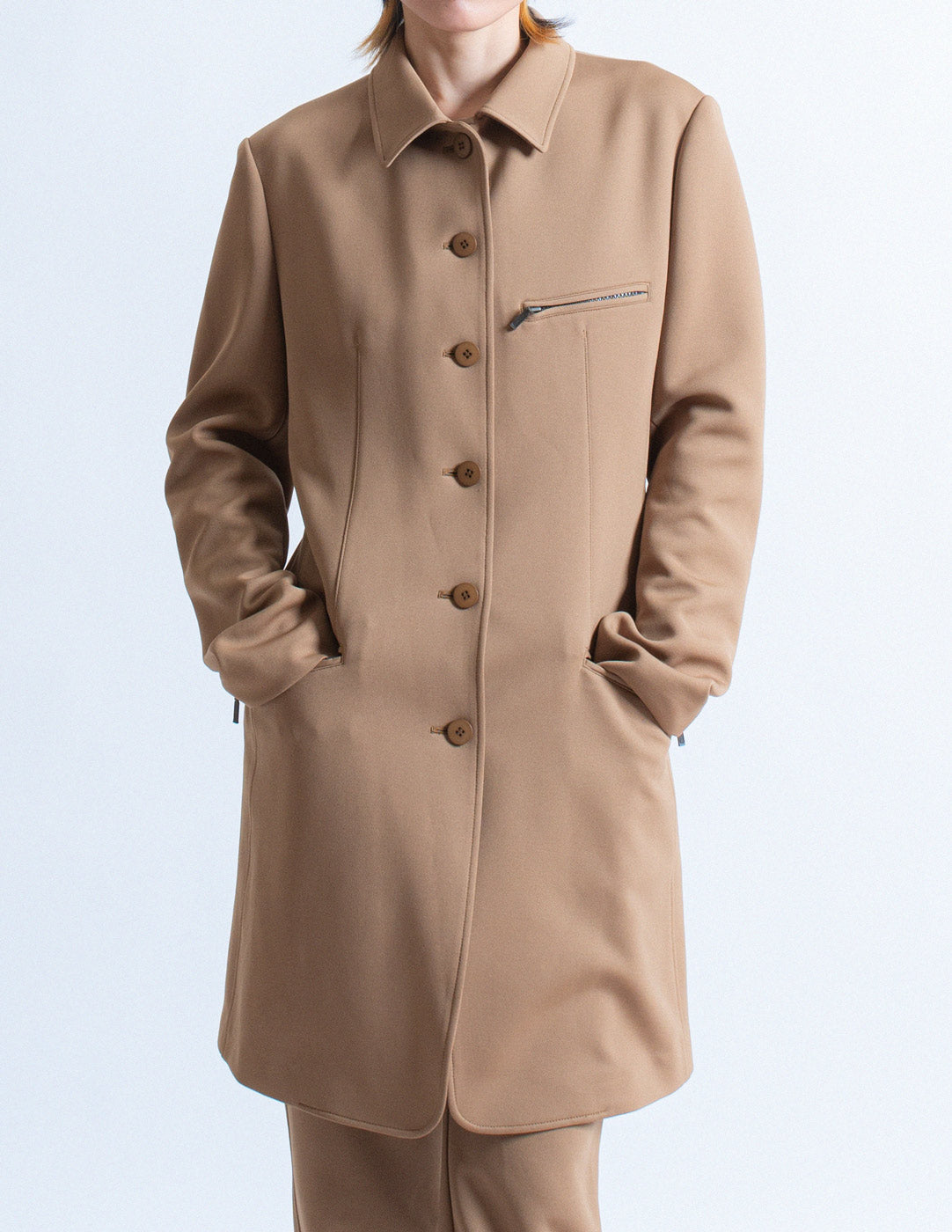 Issey Miyake camel tone long blazer and trousers set front detail