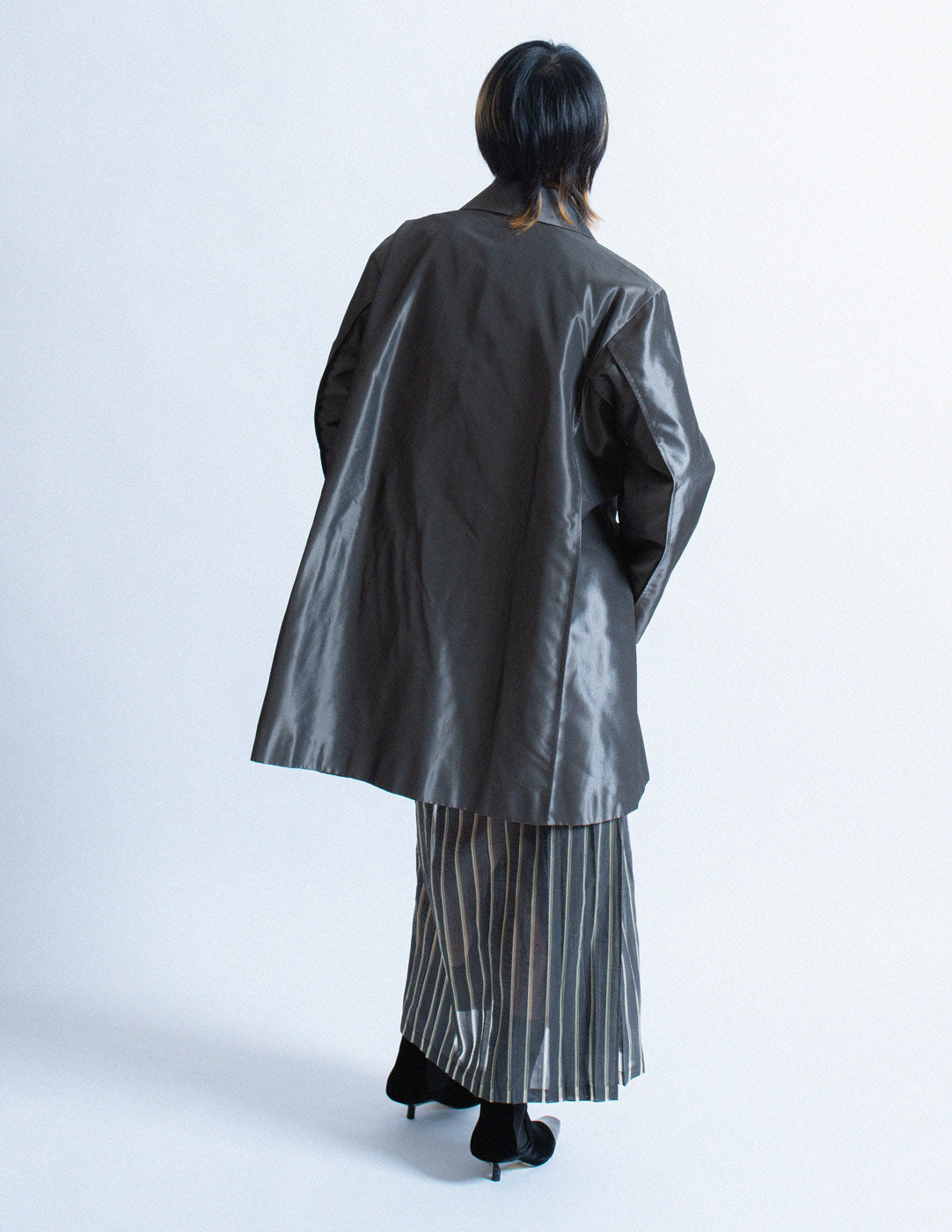 Issey Miyake iridescent slate swing coat back view