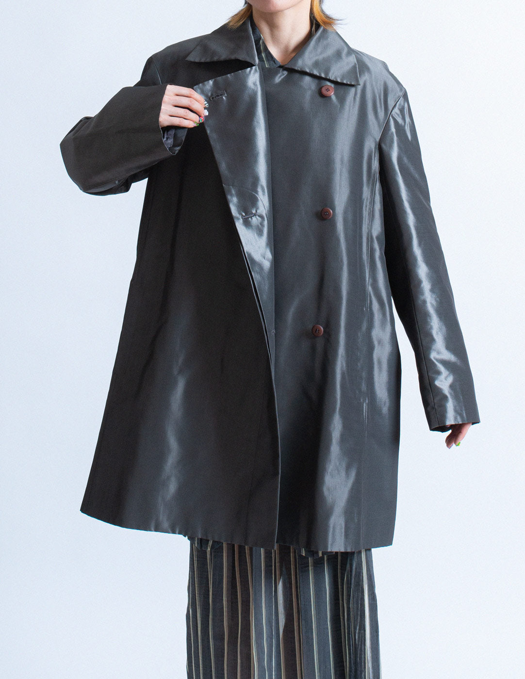 Issey Miyake iridescent slate swing coat button detail