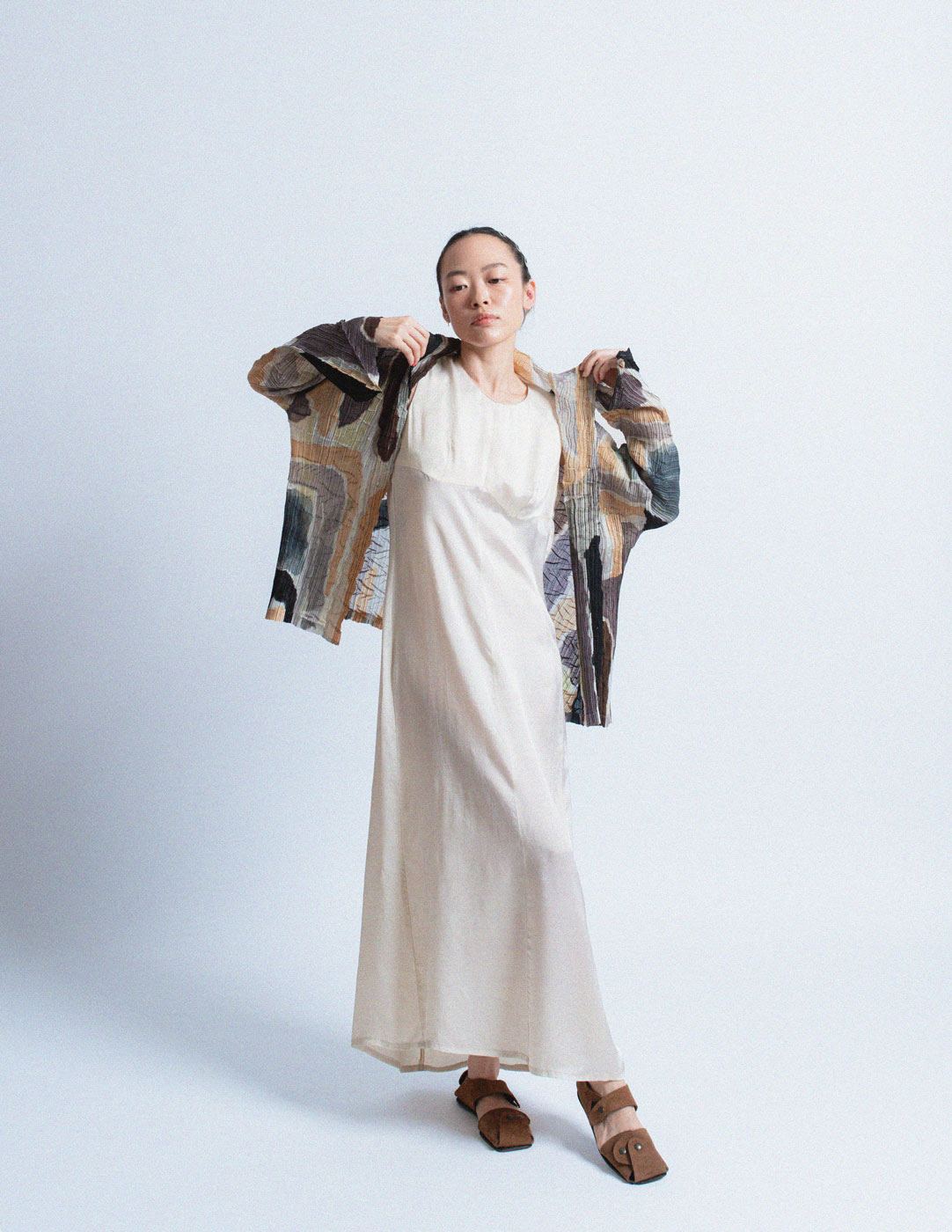 Issey Miyake earth tone pleated cardigan with abstract painterly pattern