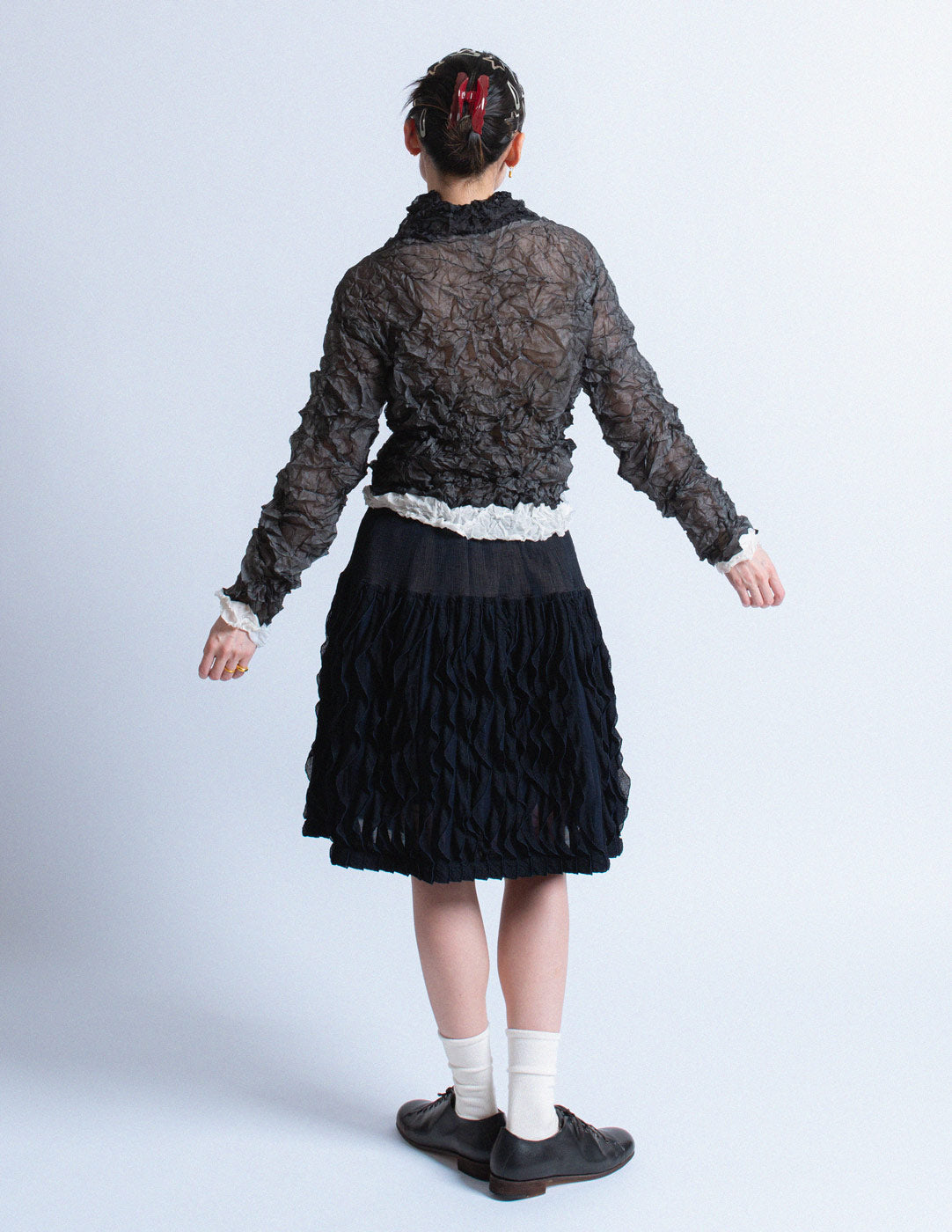 Issey Miyake black crinkled long sleeves back view