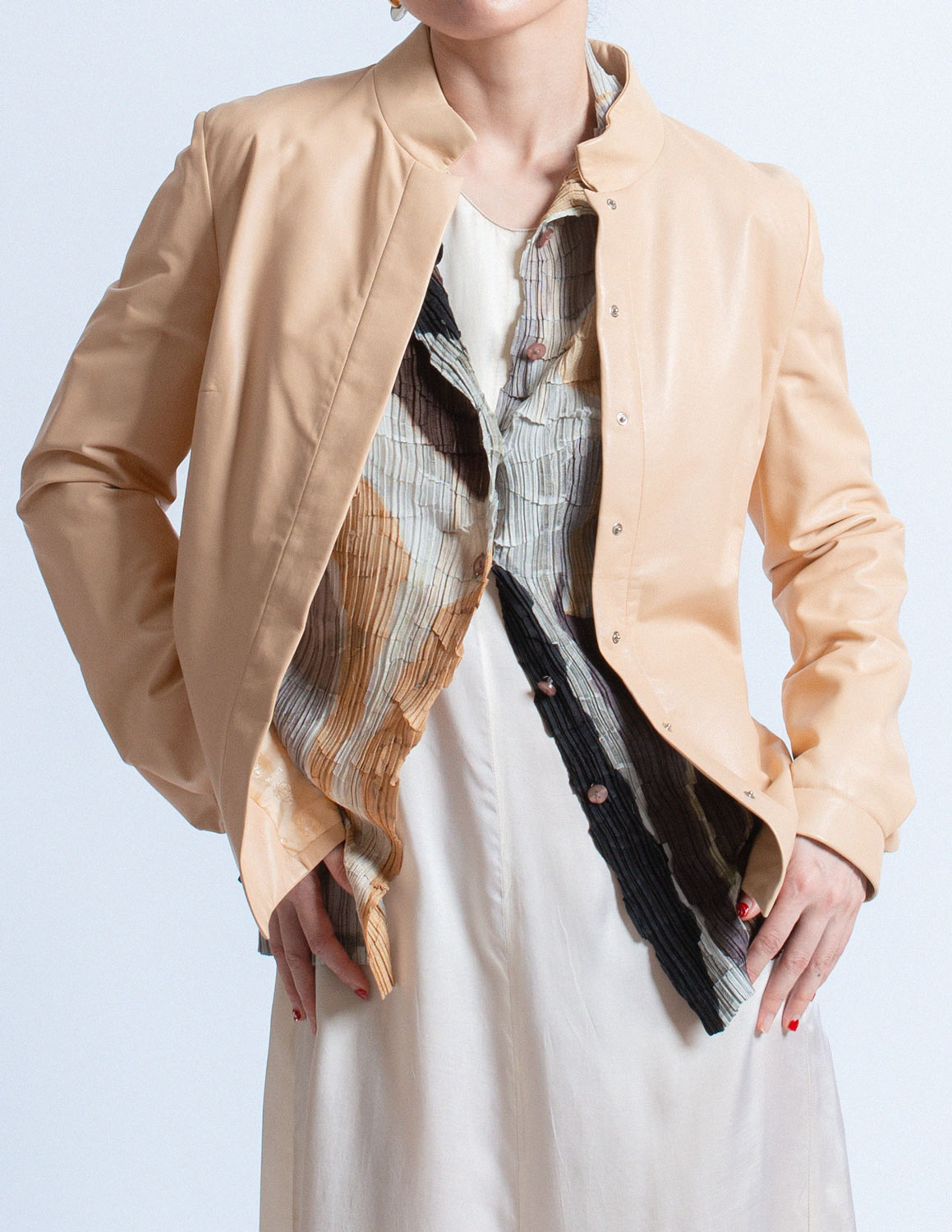Issey Miyake earth tone pleated cardigan with abstract painterly pattern layered detail