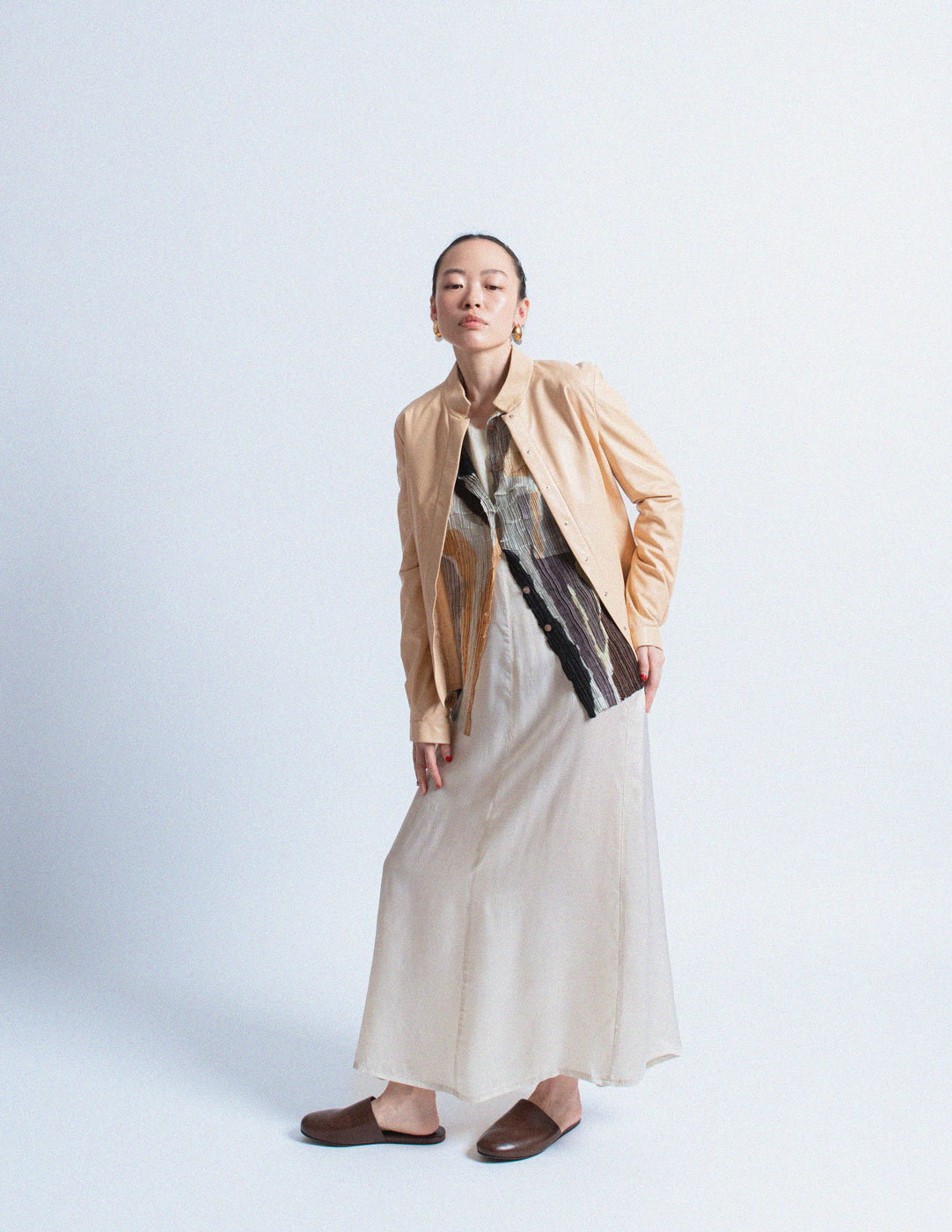 Issey Miyake earth tone pleated cardigan with abstract painterly pattern