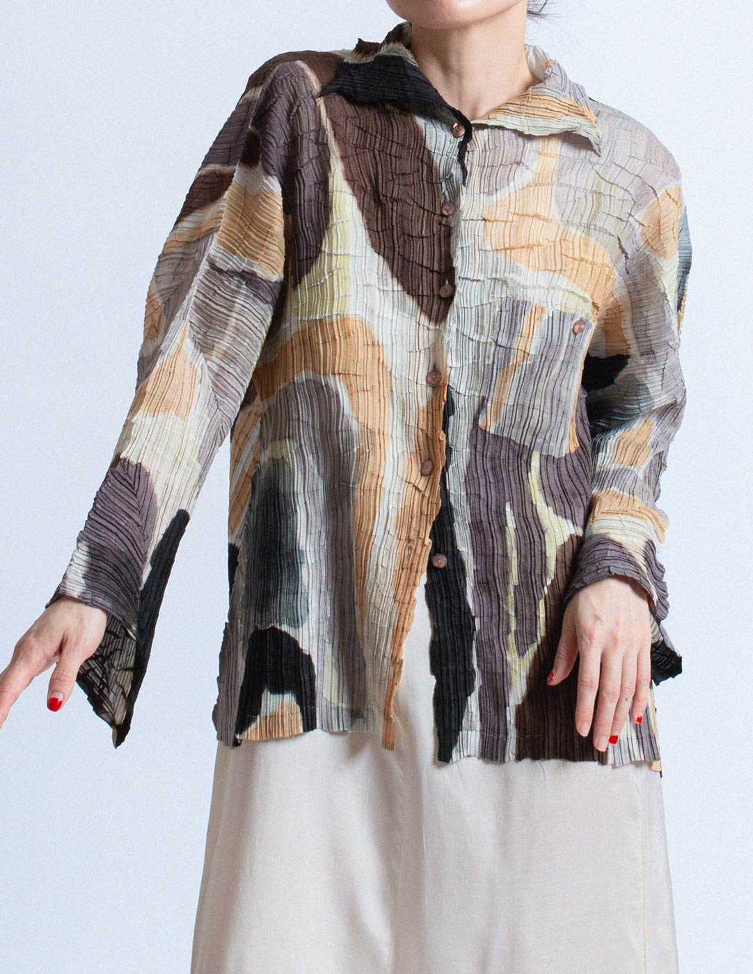 Issey Miyake earth tone pleated cardigan with abstract painterly pattern detail