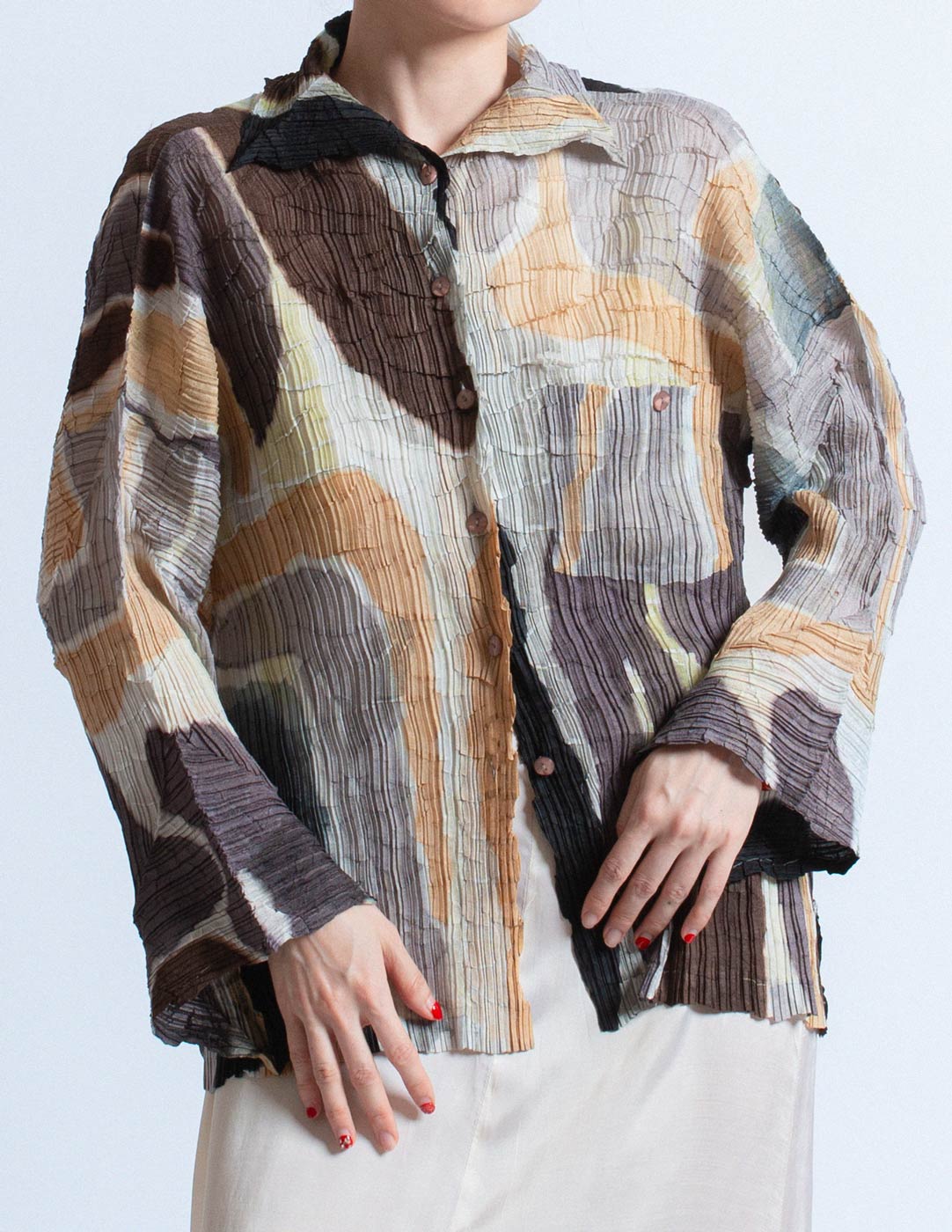 Issey Miyake earth tone pleated cardigan with abstract painterly pattern detail