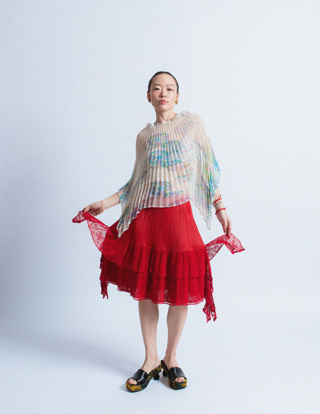 Pleats Please red pleated skirt with lace trim
