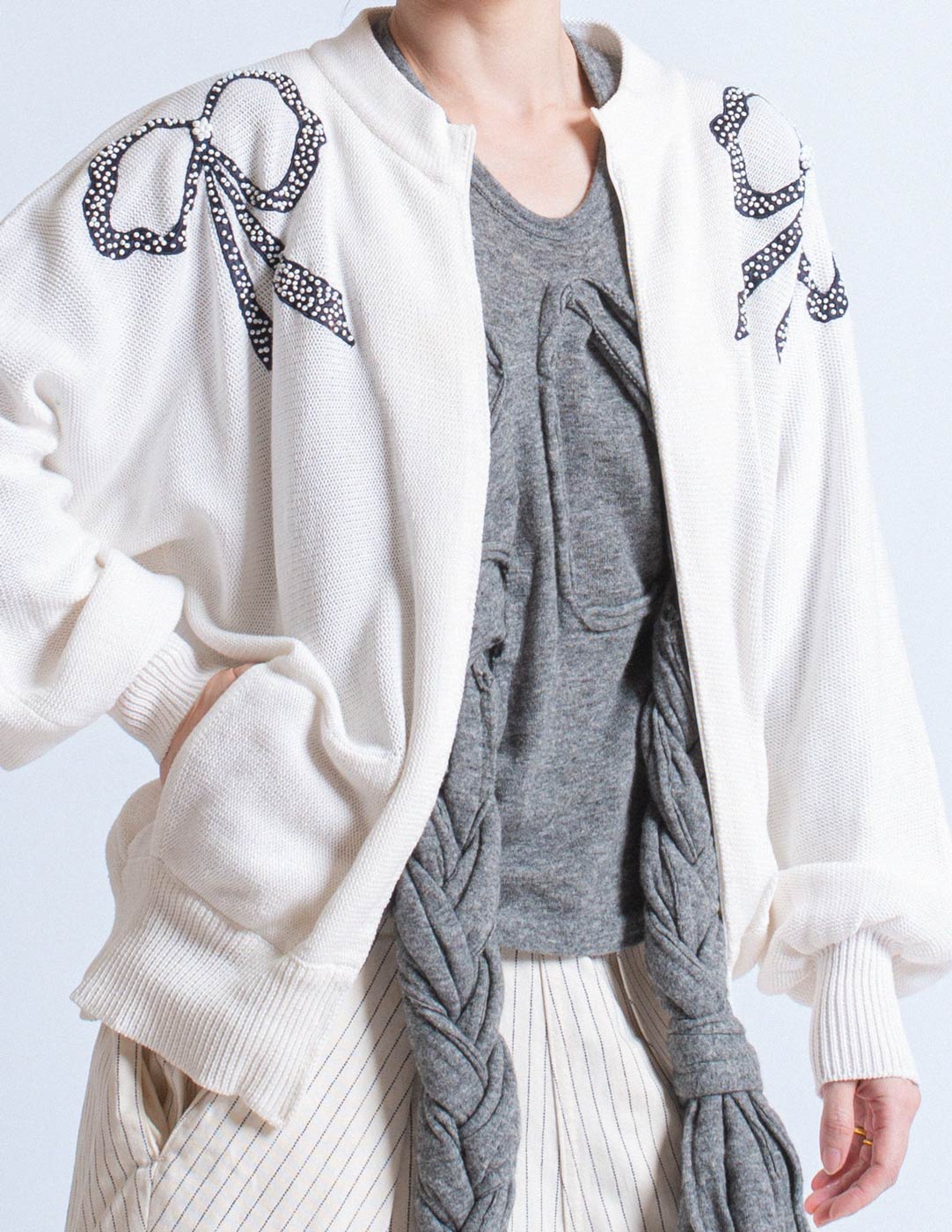 Vintage white cotton cardigan with beaded ribbon design detail