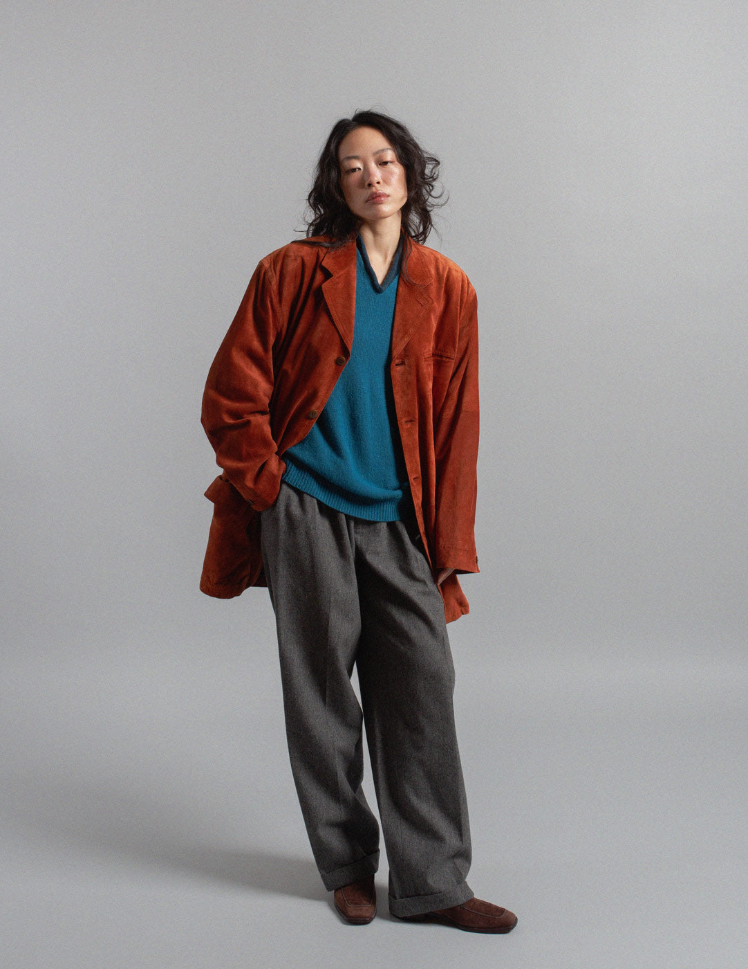 Hermès teal v-neck cashmere sweater layered