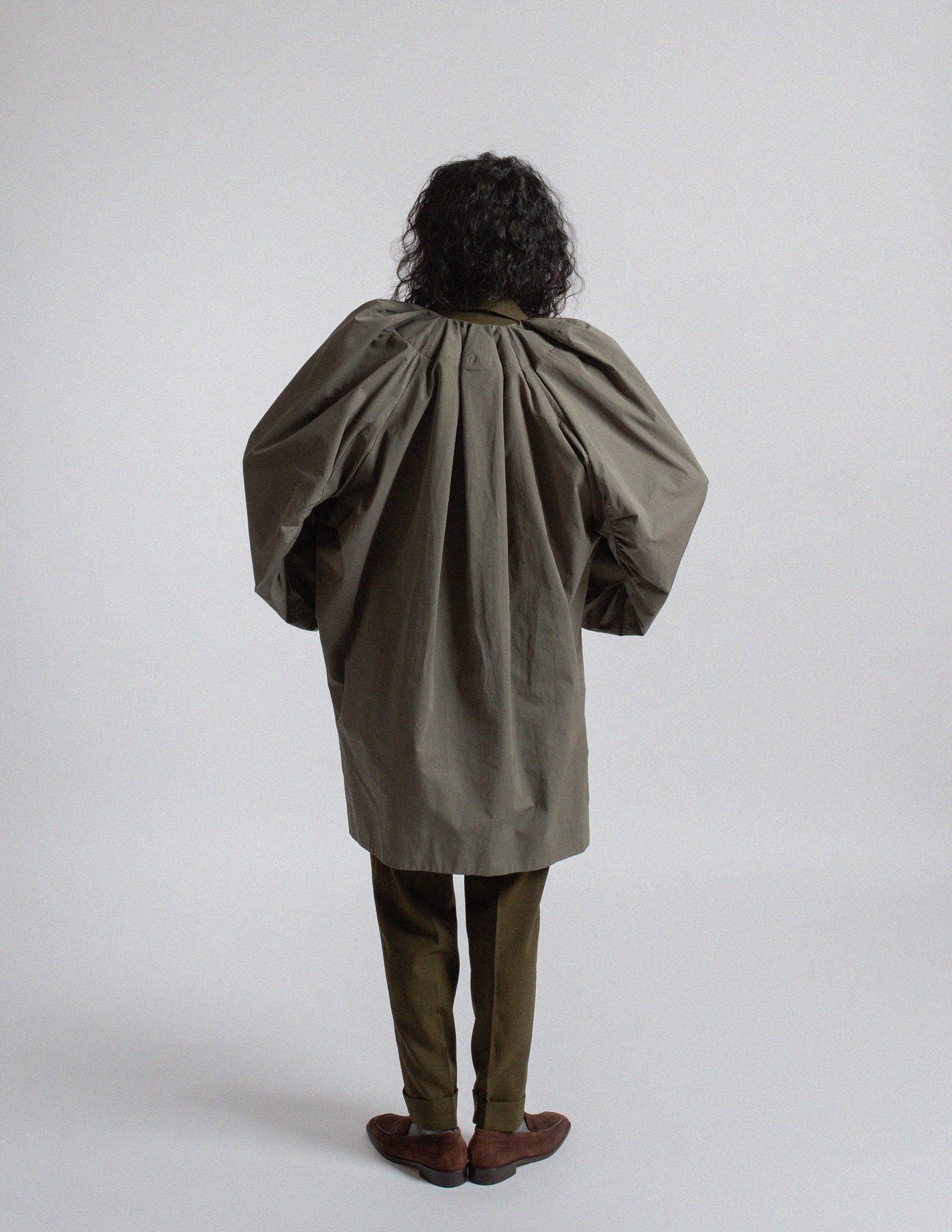Dries Van Noten olive-toned sculptural cocoon jacket back view