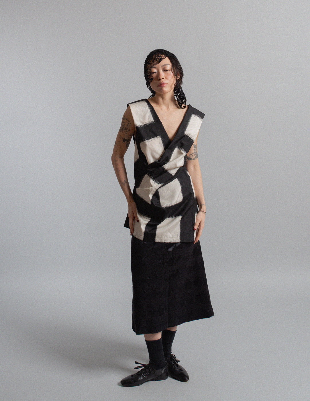 black and ivory crisscross silk top