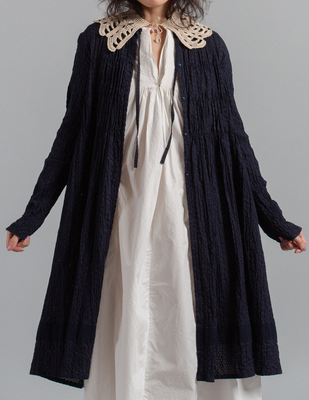 Issey Miyake navy textured crinkle cotton tie-neck gathered dress jacket