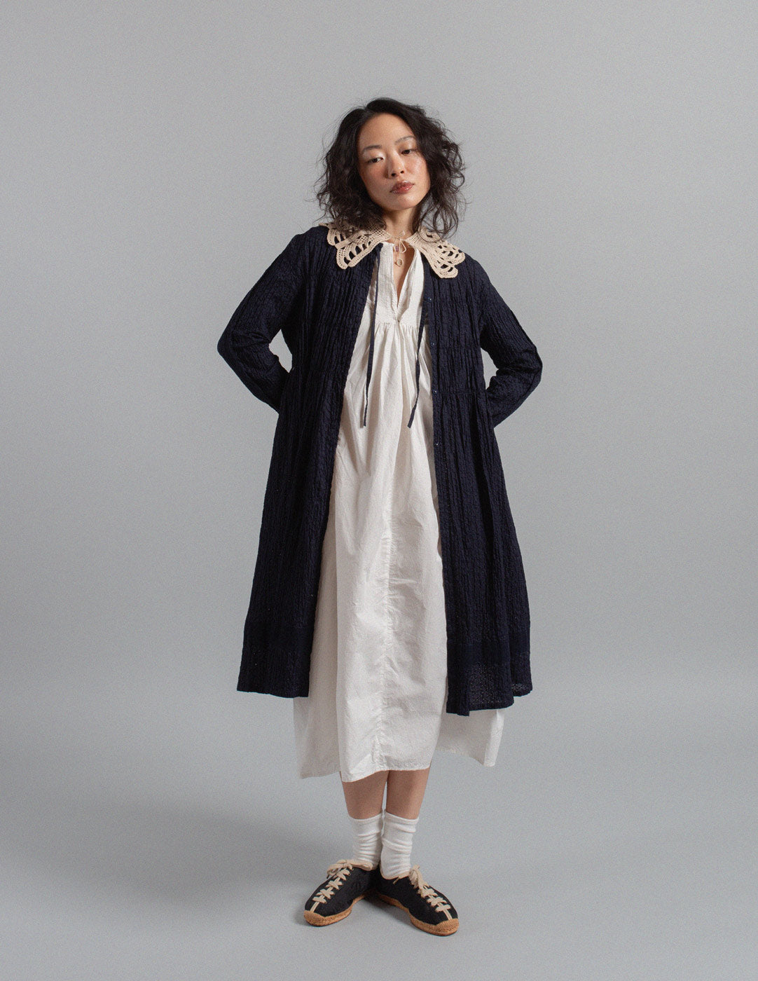 Issey Miyake navy textured crinkle cotton tie-neck gathered dress jacket