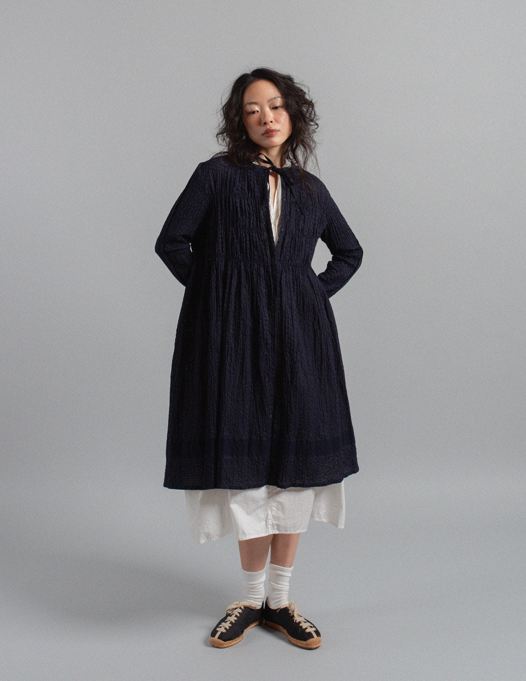 Issey Miyake navy textured crinkle cotton tie-neck gathered dress jacket