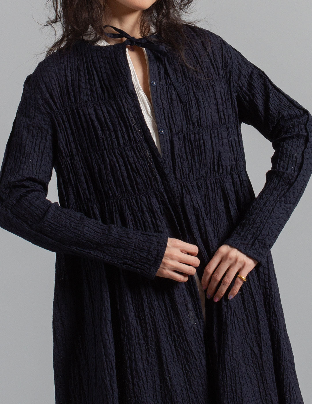 Issey Miyake navy textured crinkle cotton tie-neck gathered dress jacket detail