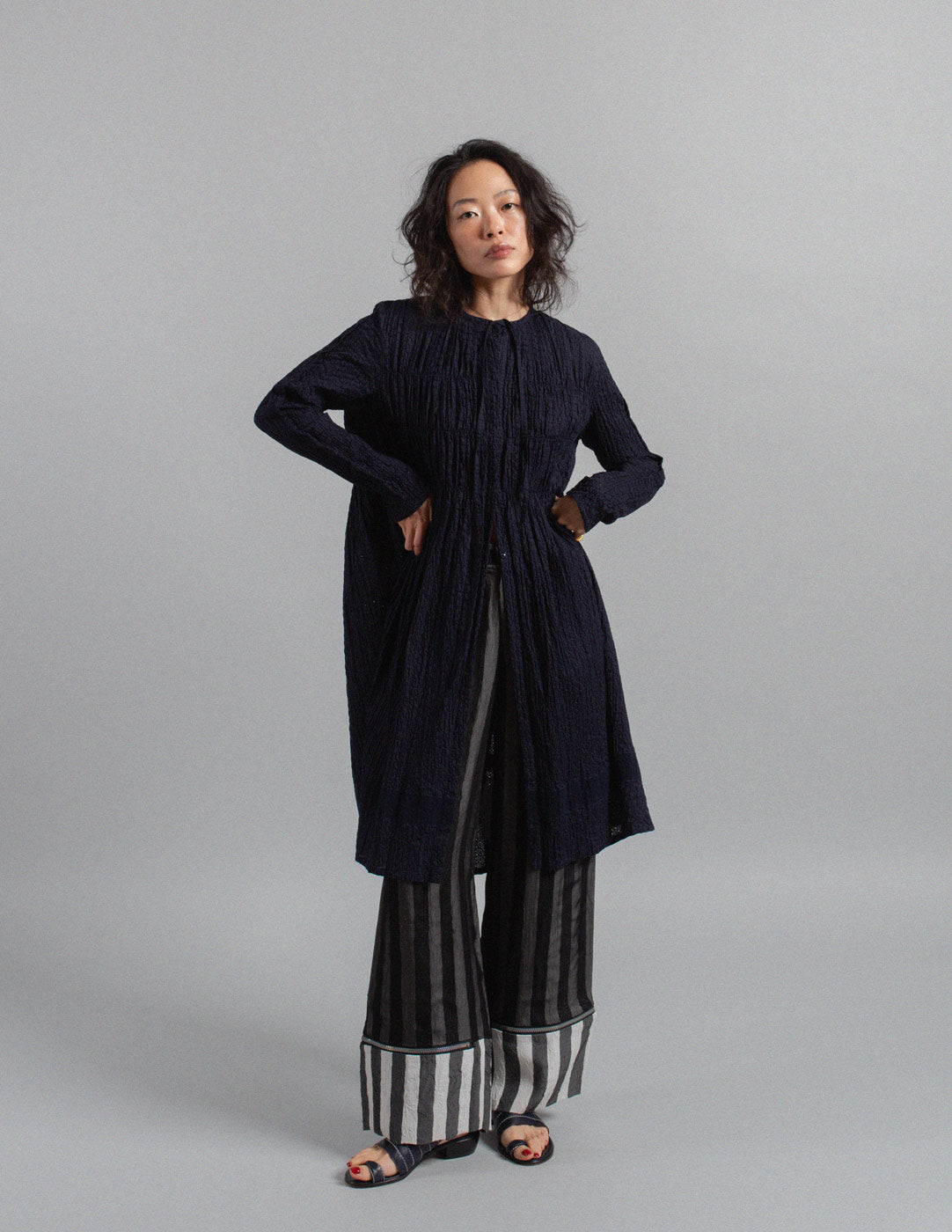 Issey Miyake navy textured crinkle cotton tie-neck gathered dress jacket