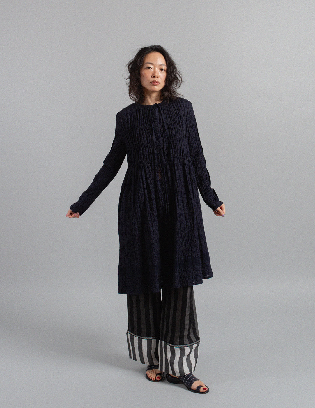 Issey Miyake navy textured crinkle cotton tie-neck gathered dress jacket