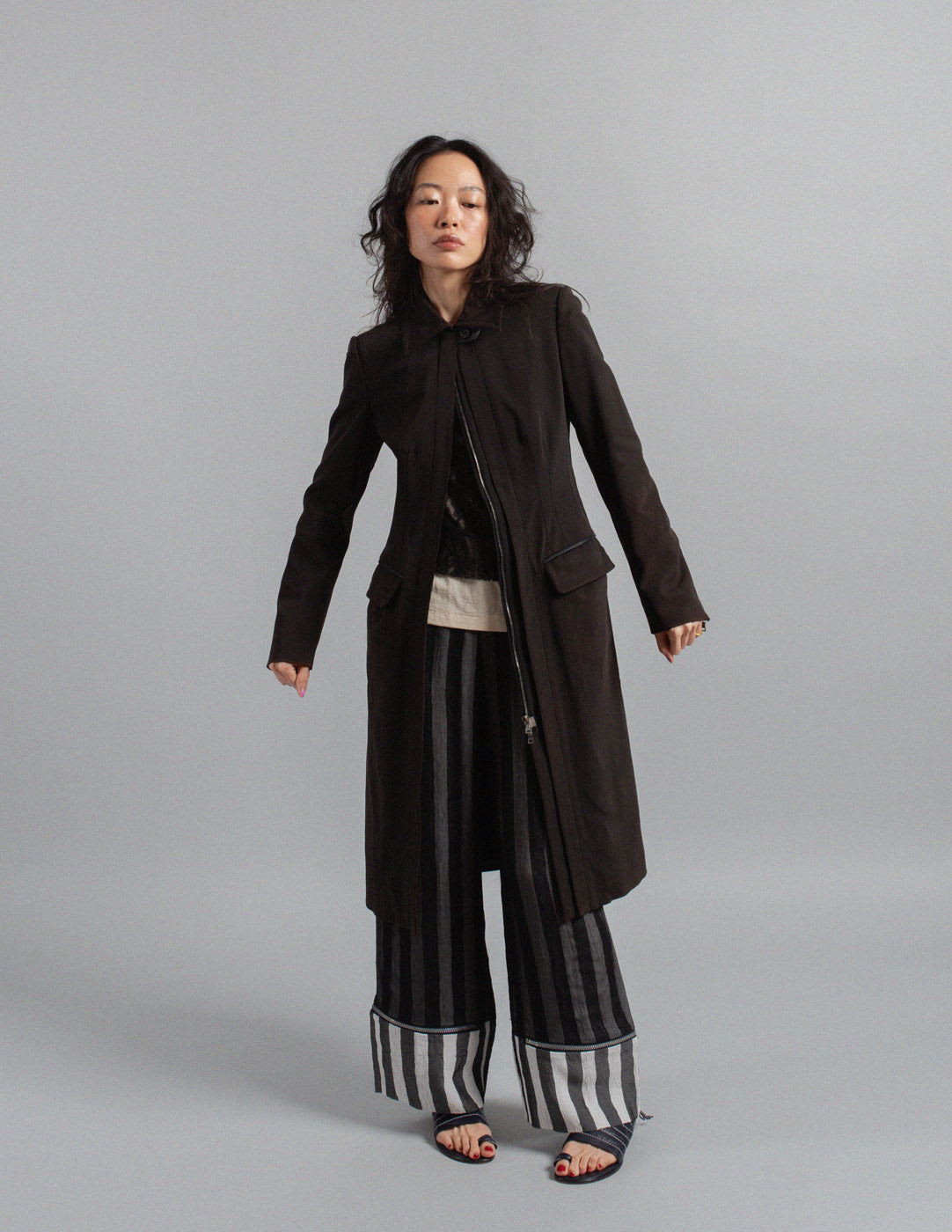 Issey Miyake layered striped trousers with zipped cuffs
