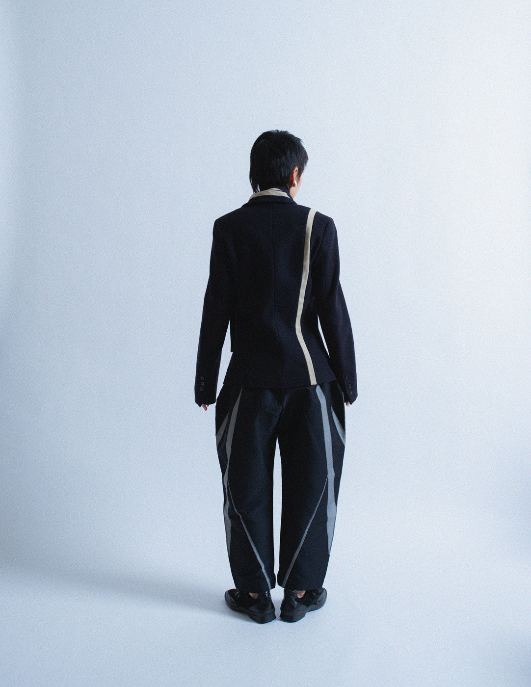 Issey Miyake geometrically structured dress trousers back view