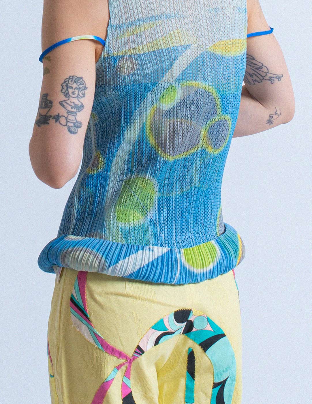 Pleats Please planet print pleated layered tank detail