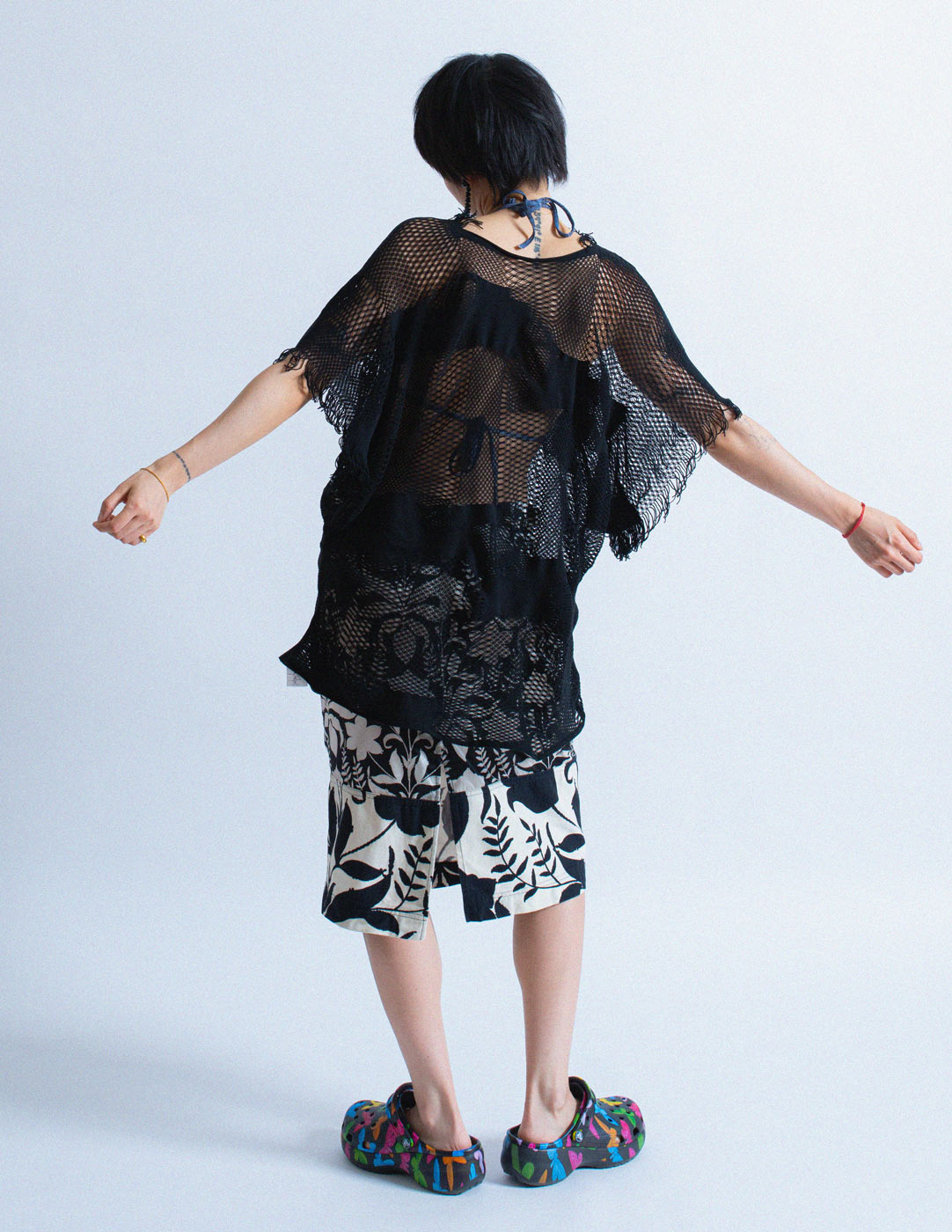 Issey Miyake net coverup with fringes back view