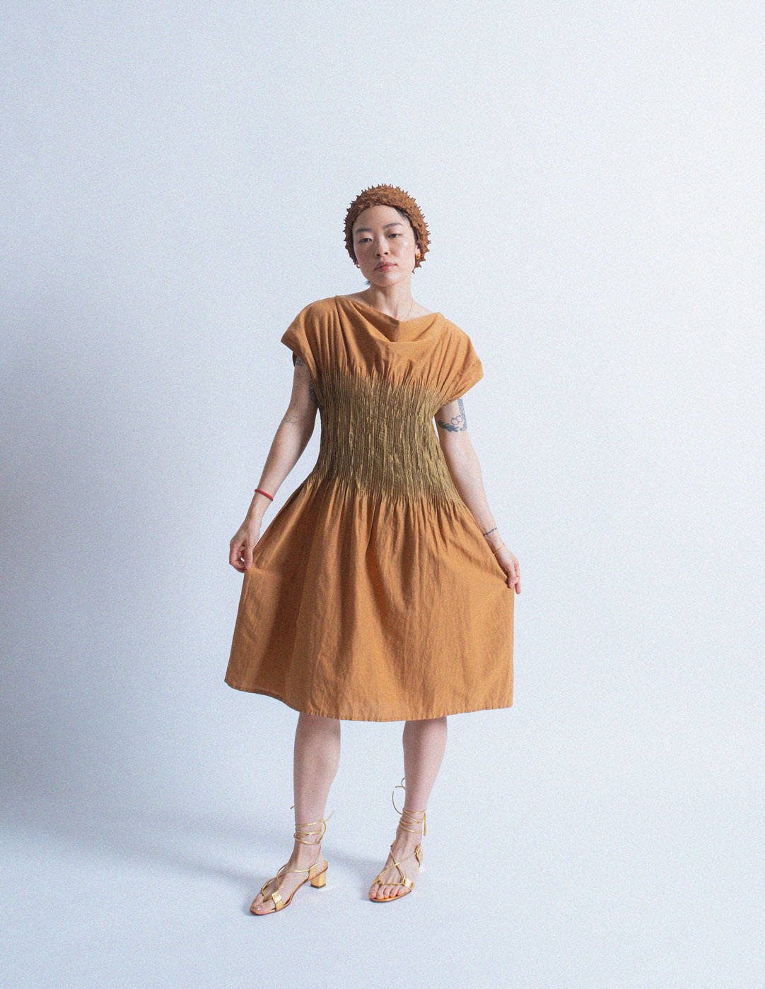 Issey Miyake burnt orange dress with bronze pleated center 