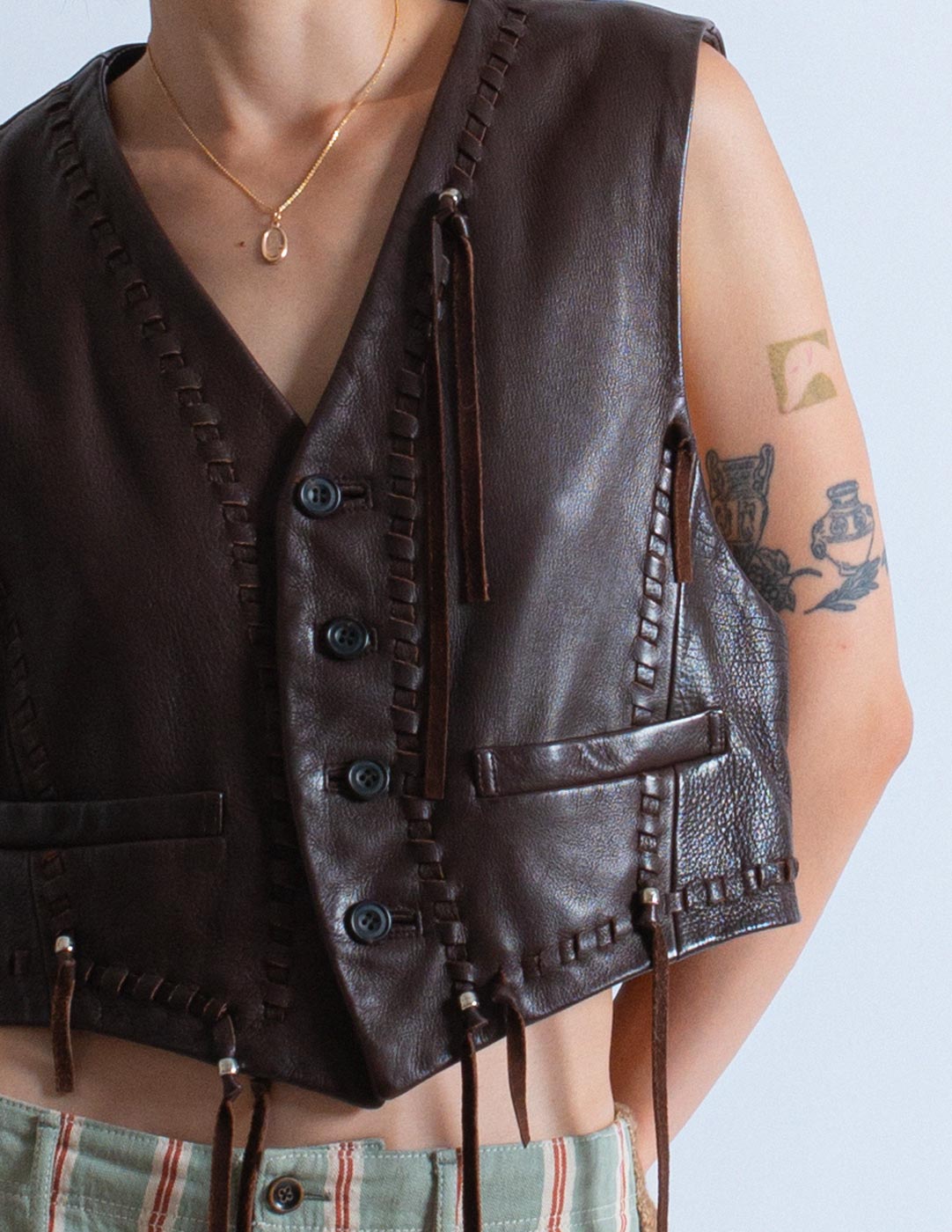 Issey Miyake vintage chocolate leather vest with tassels detail