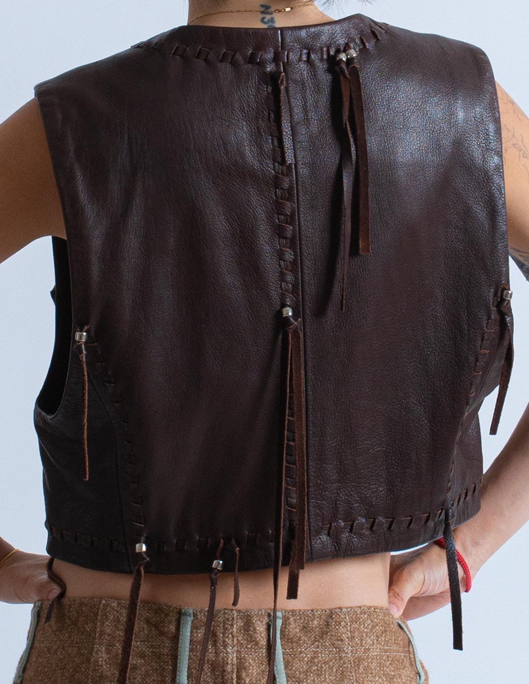 Issey Miyake vintage chocolate leather vest with tassels back detail