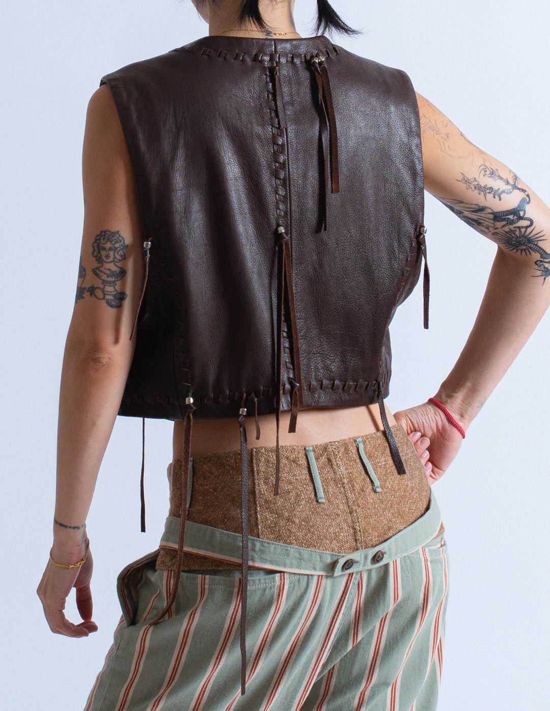 Issey Miyake vintage chocolate leather vest with tassels back detail