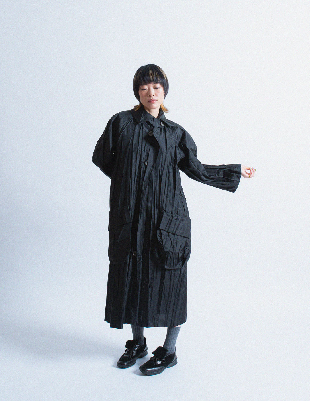 Issey Miayke black pleated spring coat