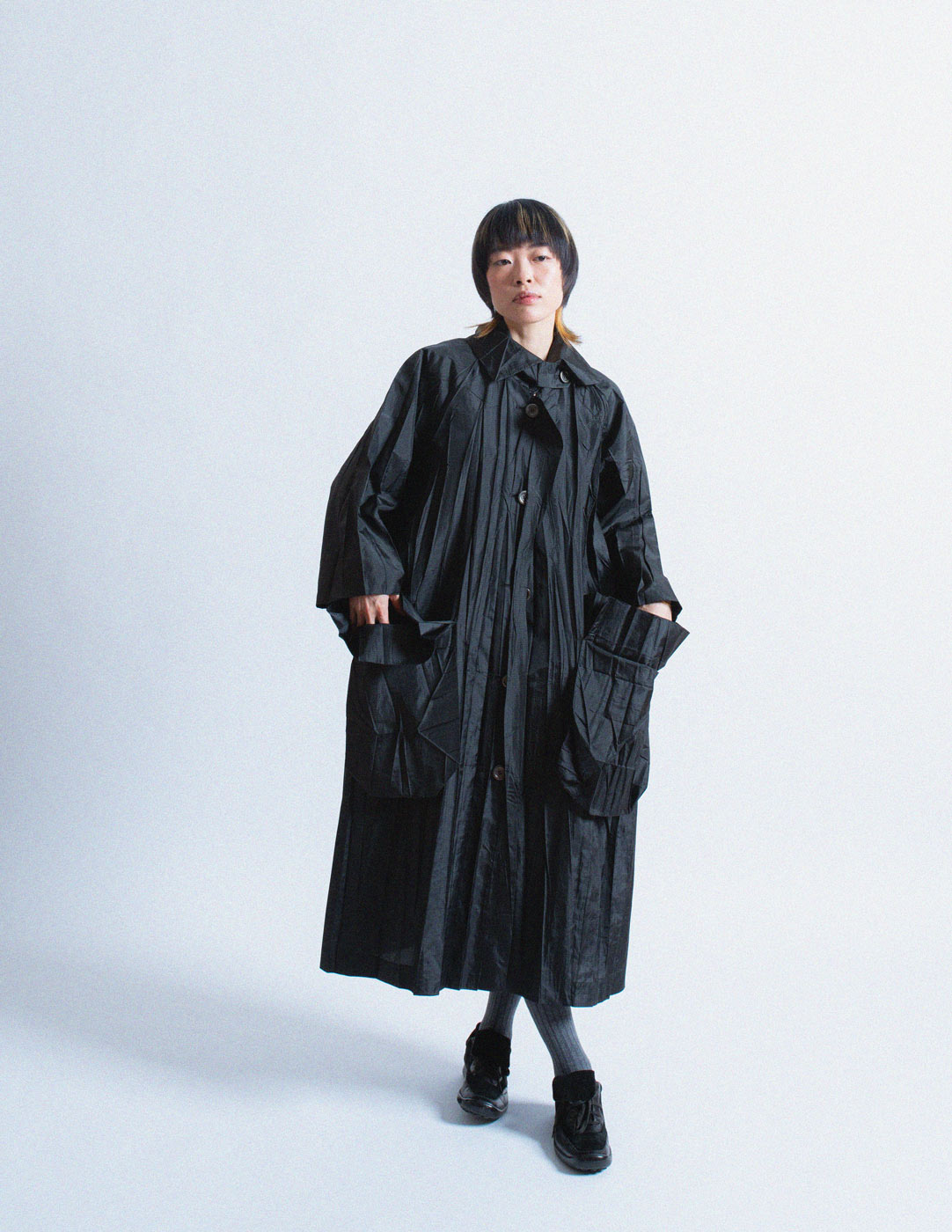 Issey Miayke black pleated spring coat