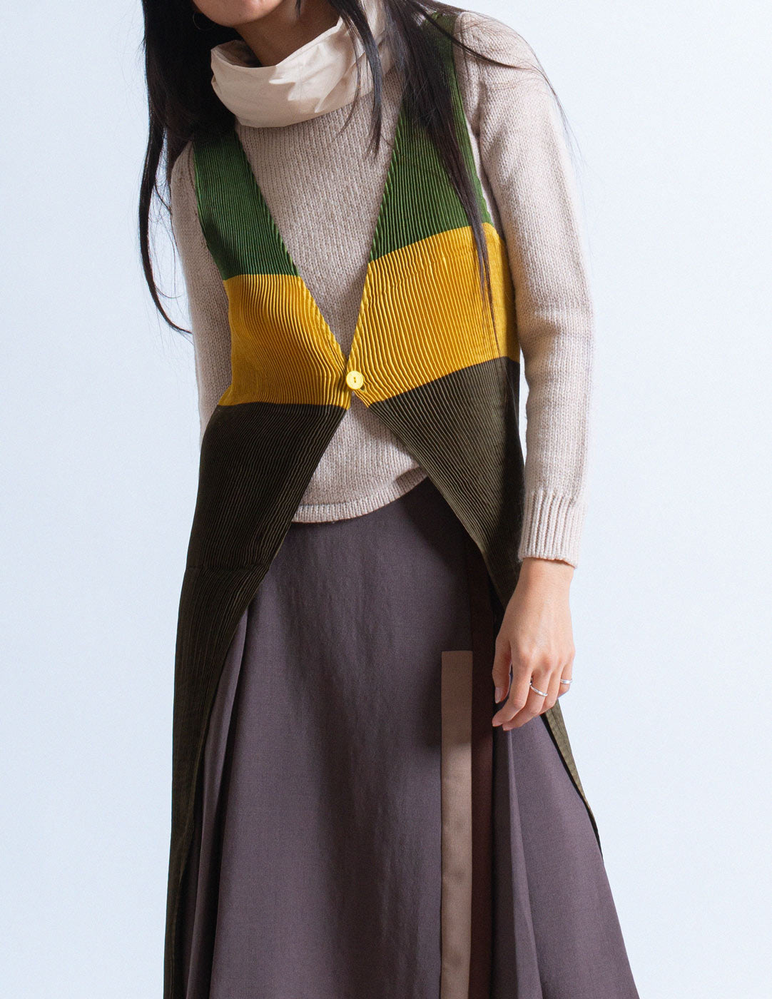Issey Miyake tri-colored pleated apron dress detail