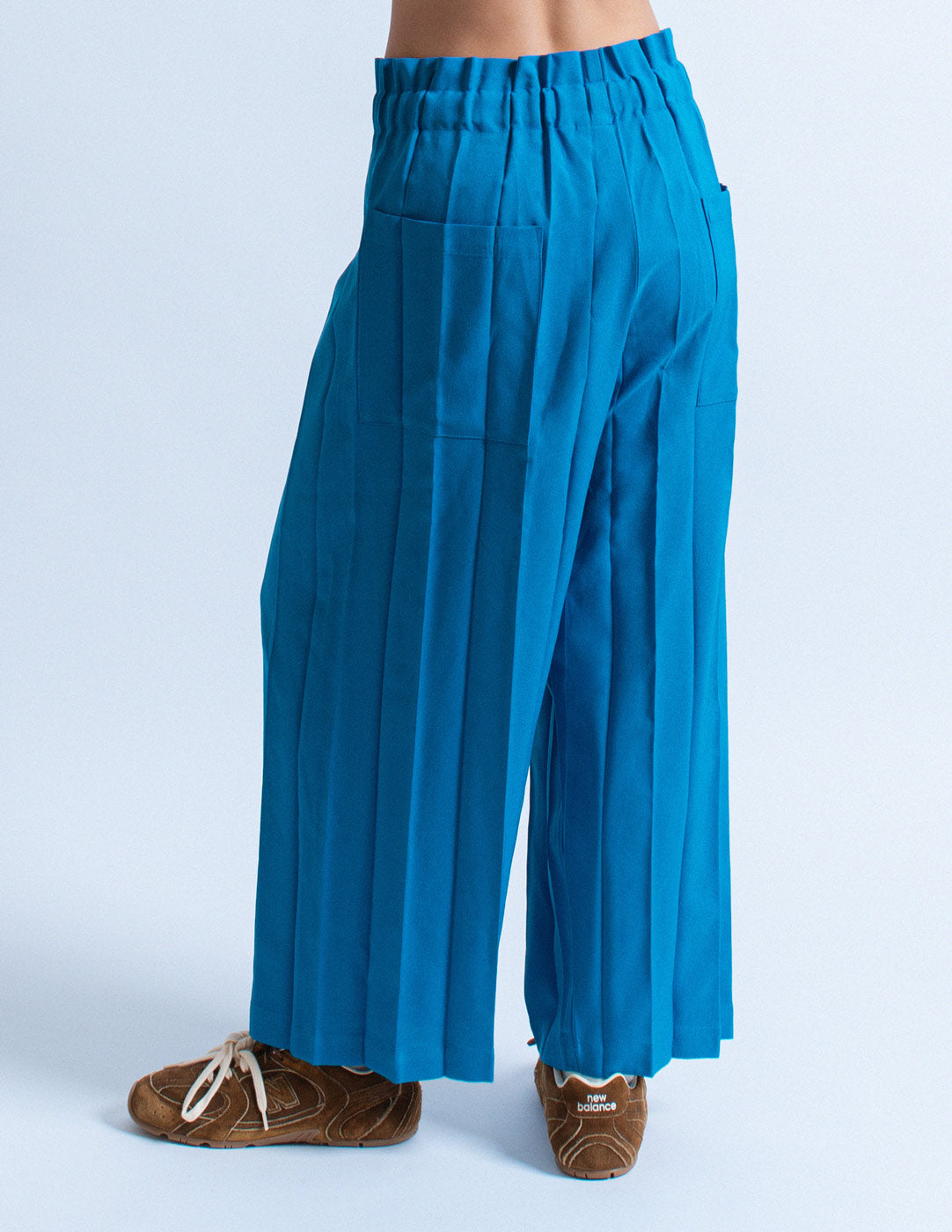 Issey Miyake blue pleated trousers back detail