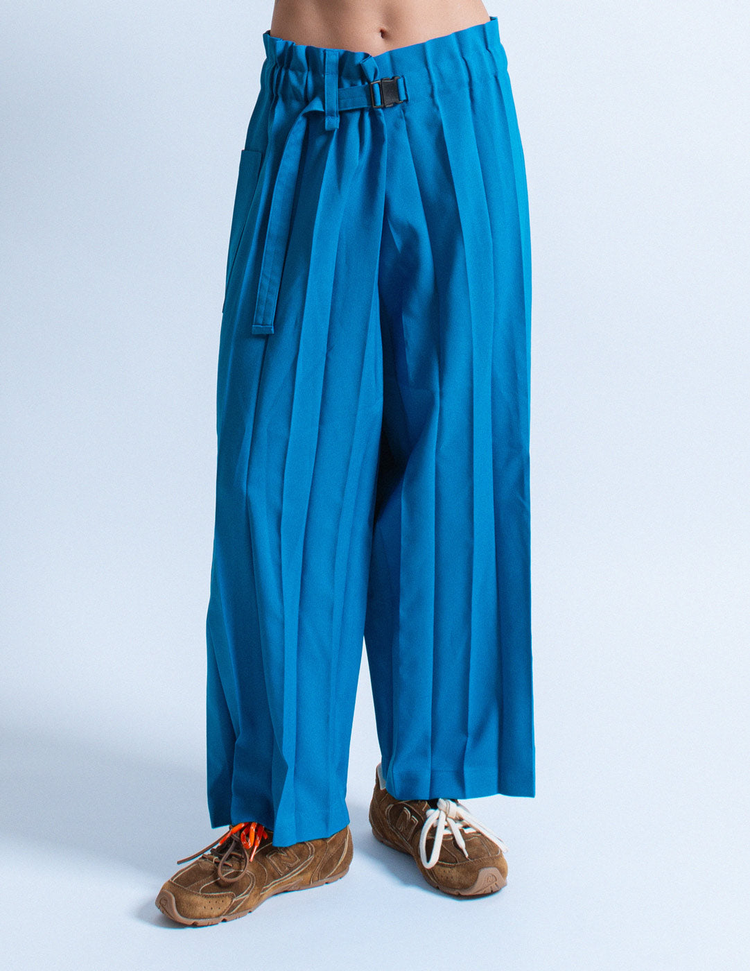 Issey Miyake blue pleated trousers detail