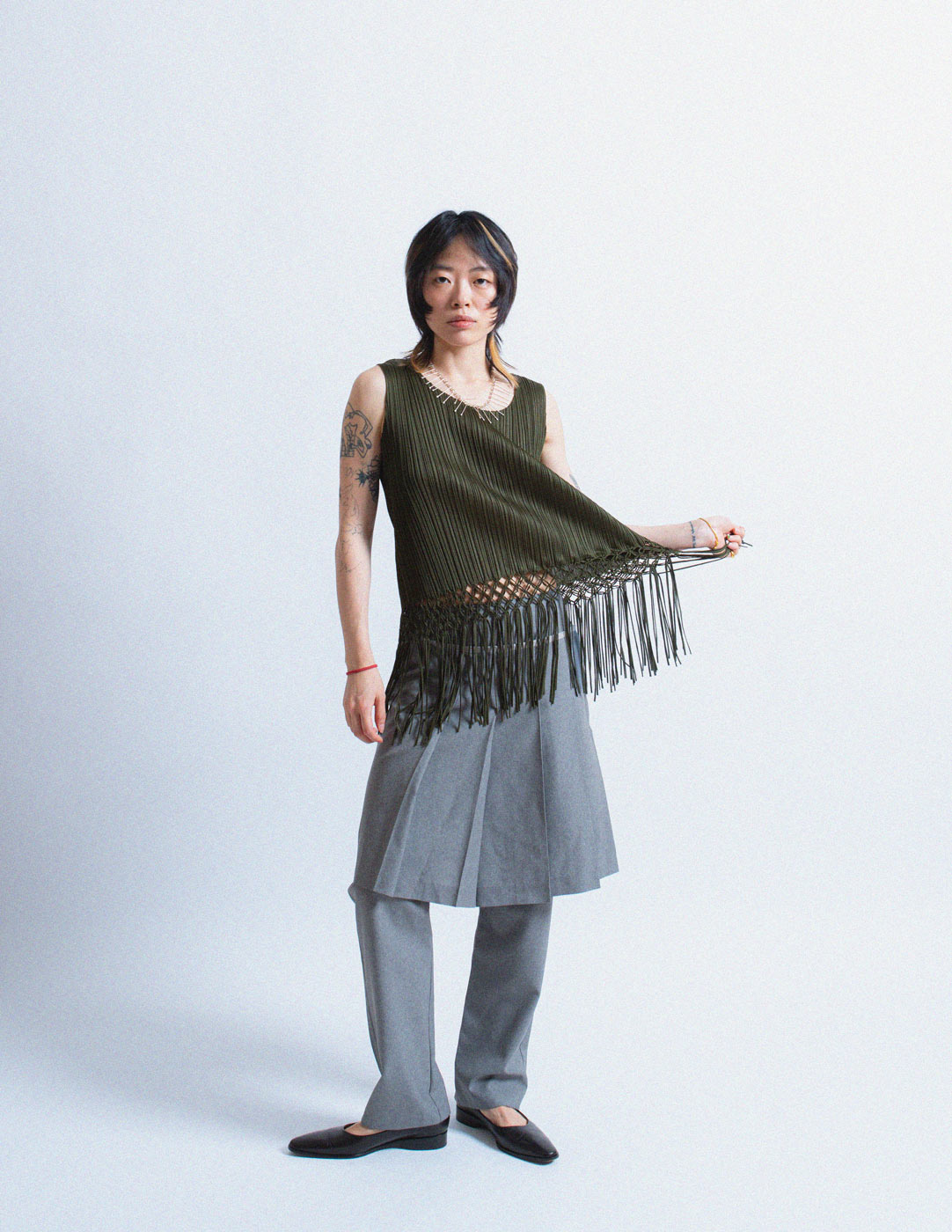 Pleats Please olive green pleated tank with woven tassels