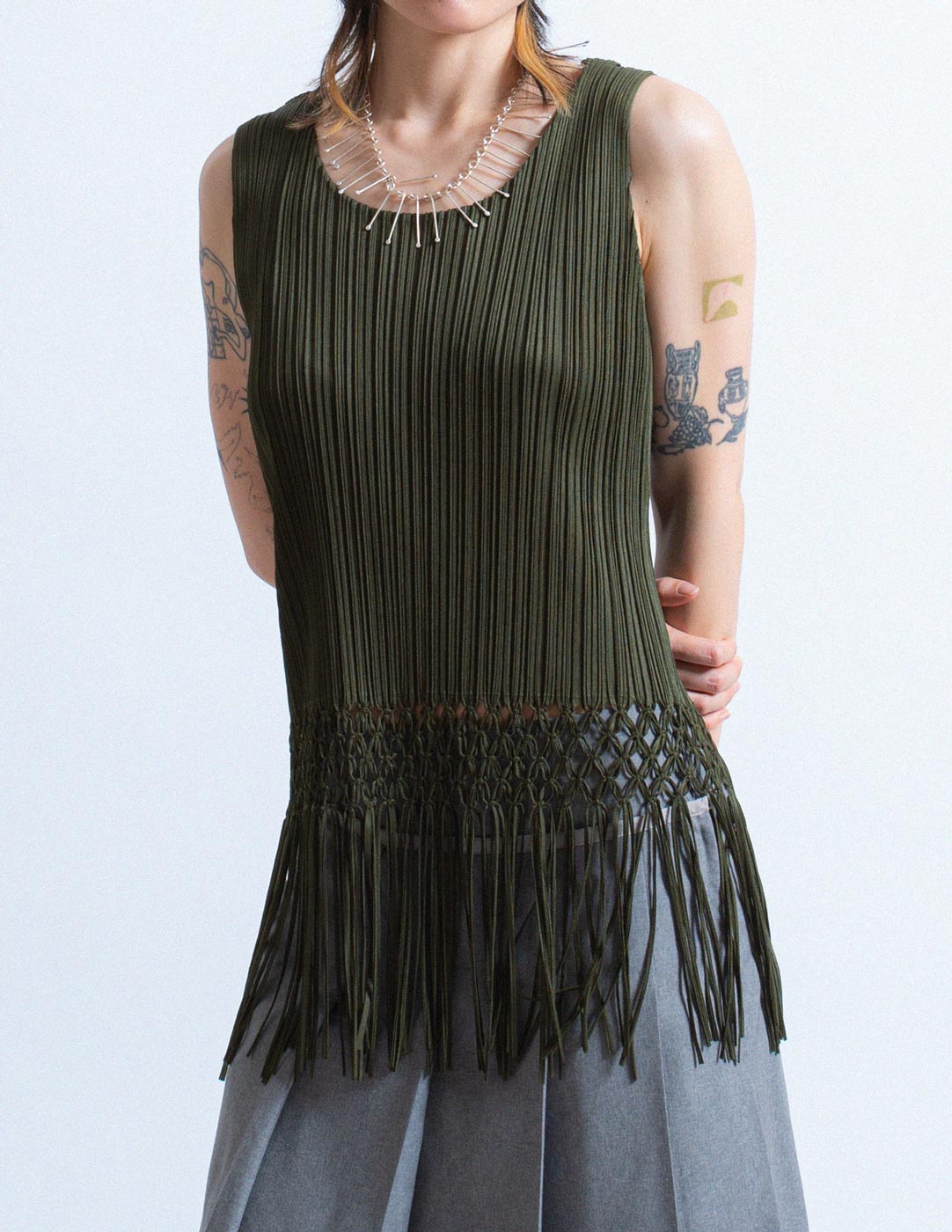 Pleats Please olive green pleated tank with woven tassels front detail