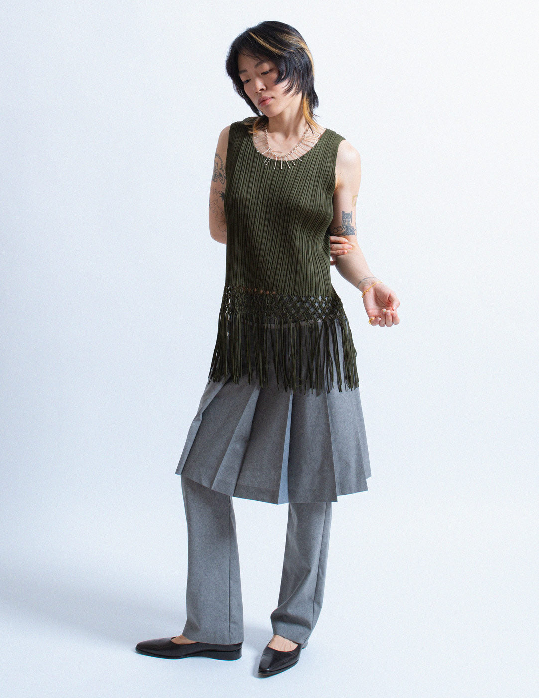 Pleats Please olive green pleated tank with woven tassels