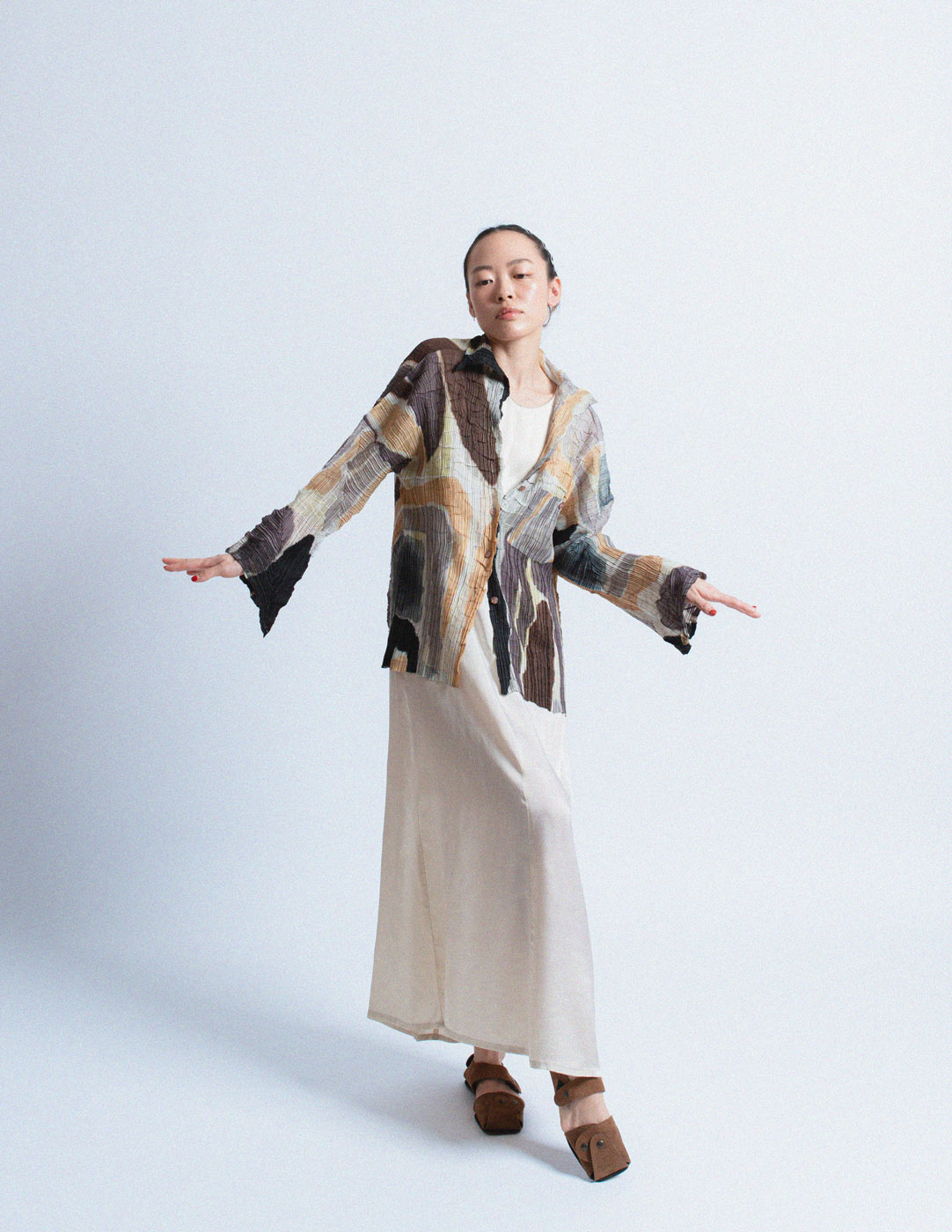 Issey Miyake earth tone pleated cardigan with abstract painterly pattern 