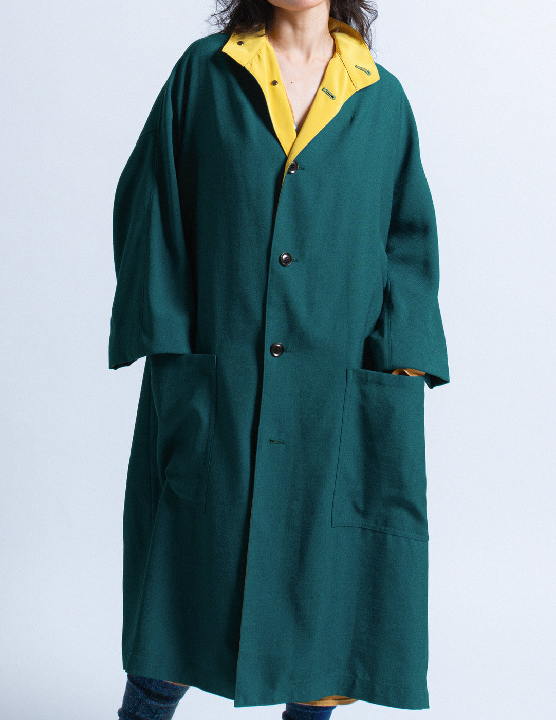 Y's teal outer coat with mustard trim detail