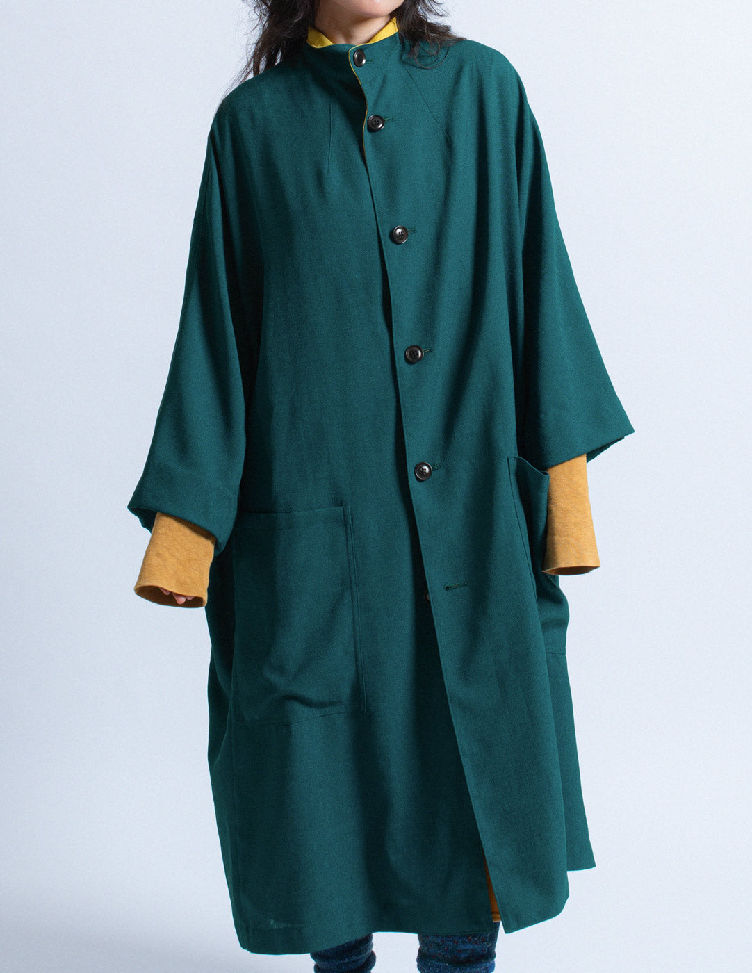 Y's teal outer coat with mustard trim detail