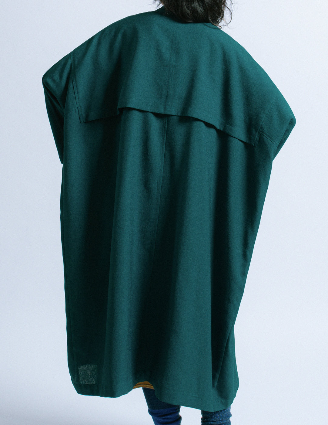Y's teal outer coat with mustard trim back detail