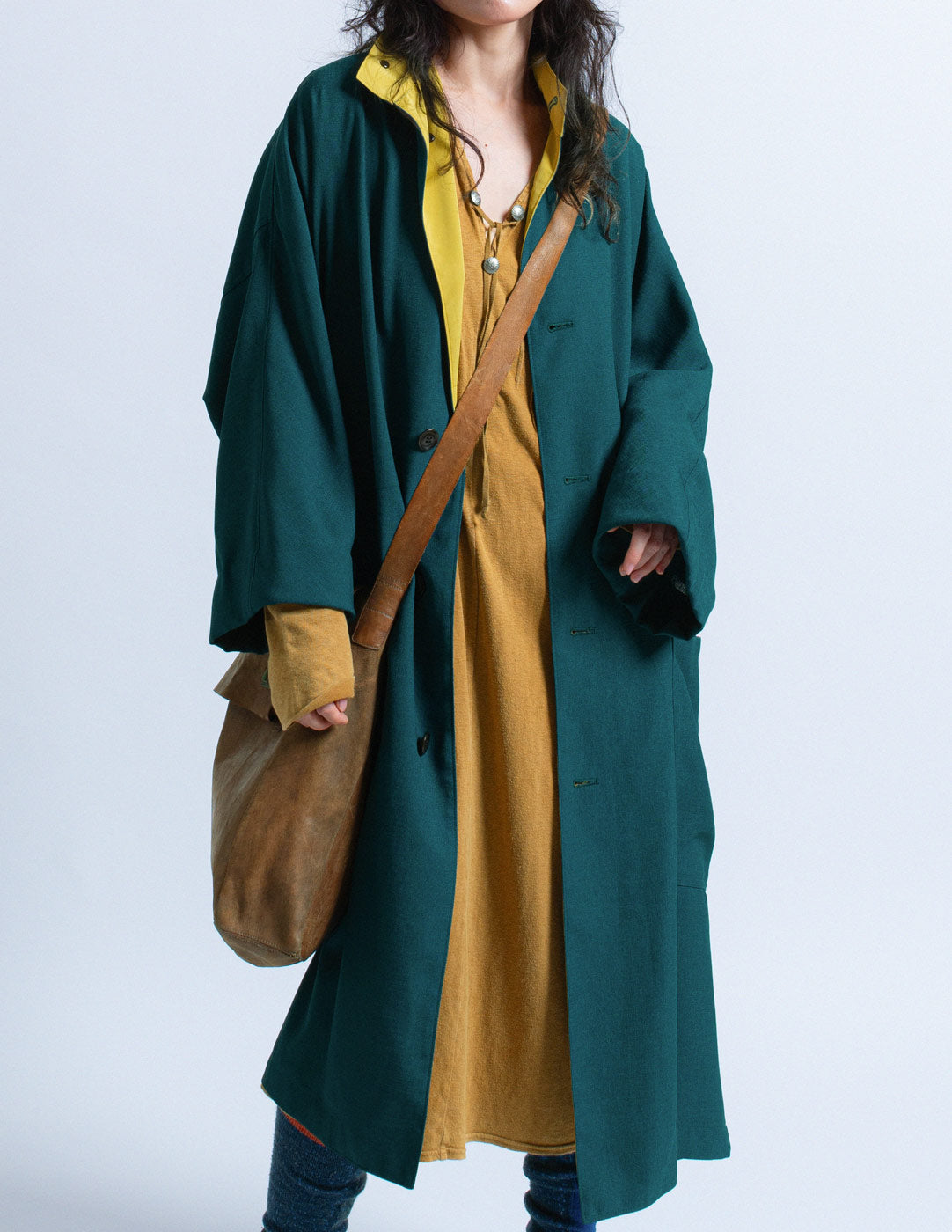 Y's teal outer coat with mustard trim front detail