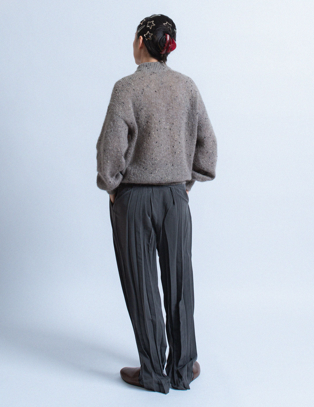 Issey Miyake charcoal gray pleated trousers back view