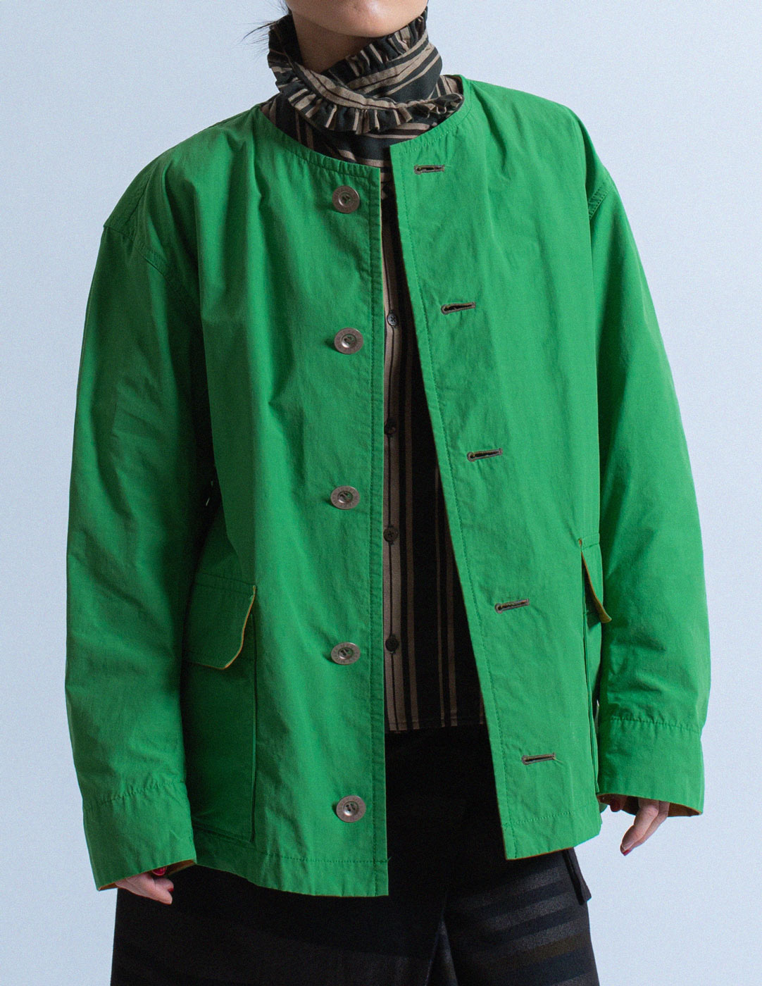 Issey Miyake Men green and mustard cotton buttoned jacket front detail