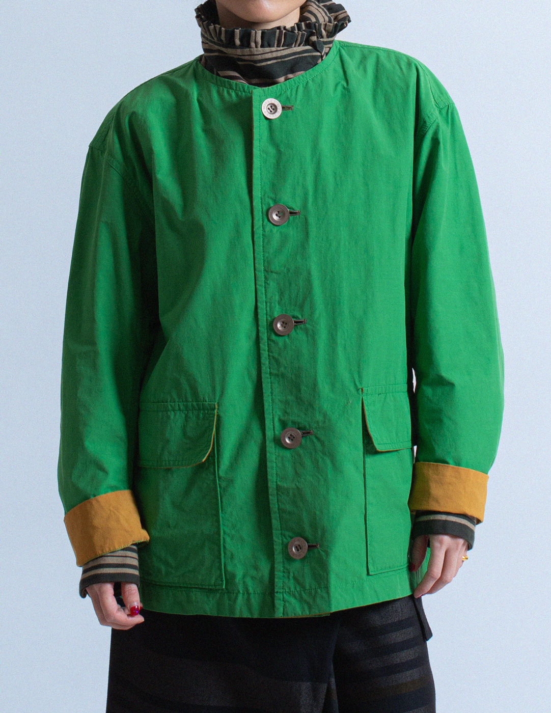 Issey Miyake Men green and mustard cotton buttoned jacket detail