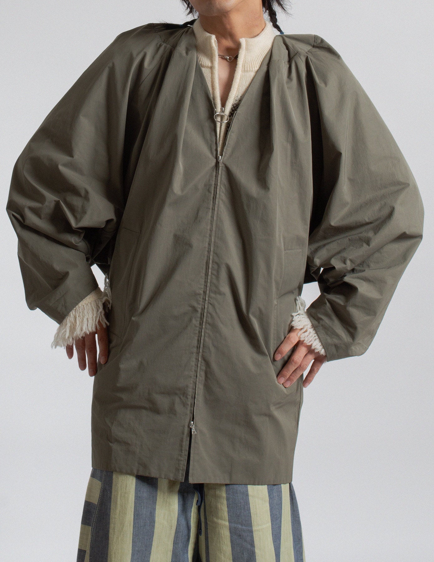 Dries Van Noten olive-toned sculptural cocoon jacket detail