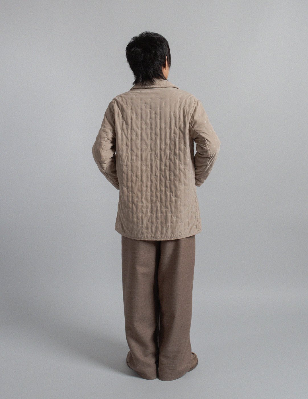 Hermès vintage warm gray quilted coat with embroidered motif back view