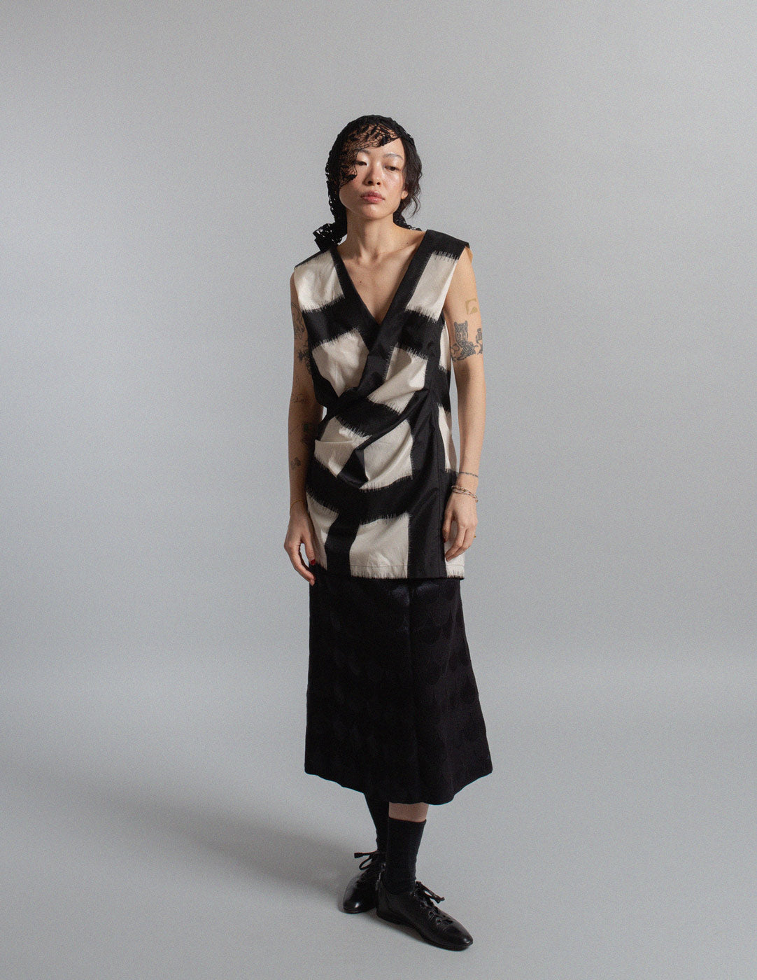 black and ivory crisscross silk top