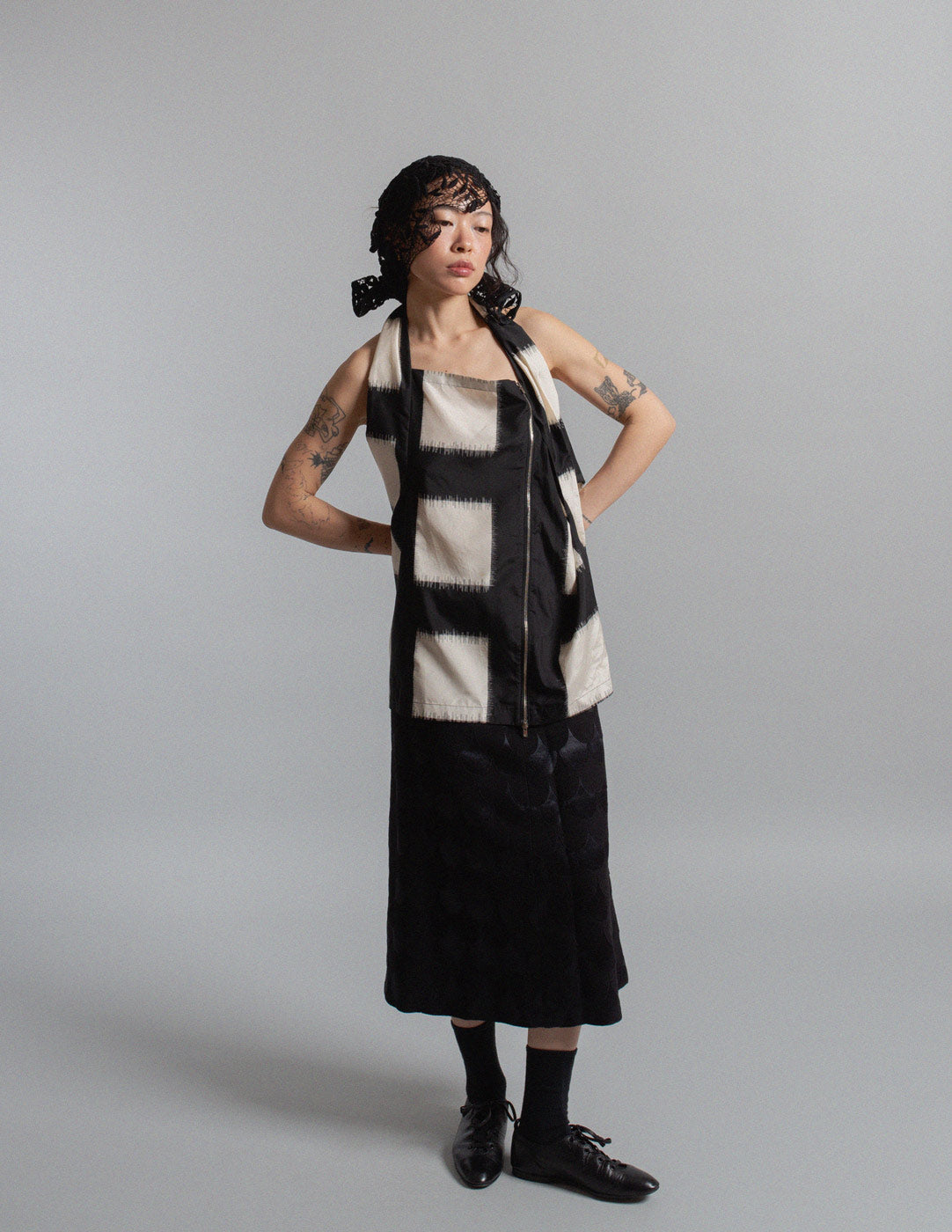 black and ivory crisscross silk top