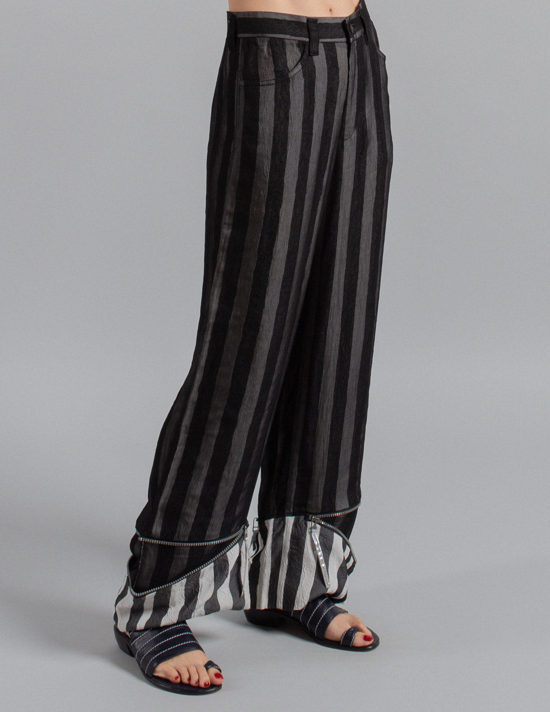 Issey Miyake layered striped trousers with zipped cuffs side detail
