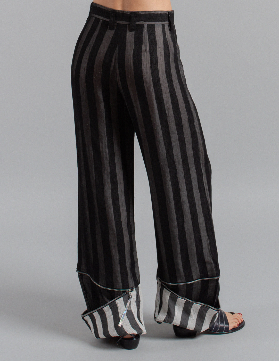 Issey Miyake layered striped trousers with zipped cuffs back detail